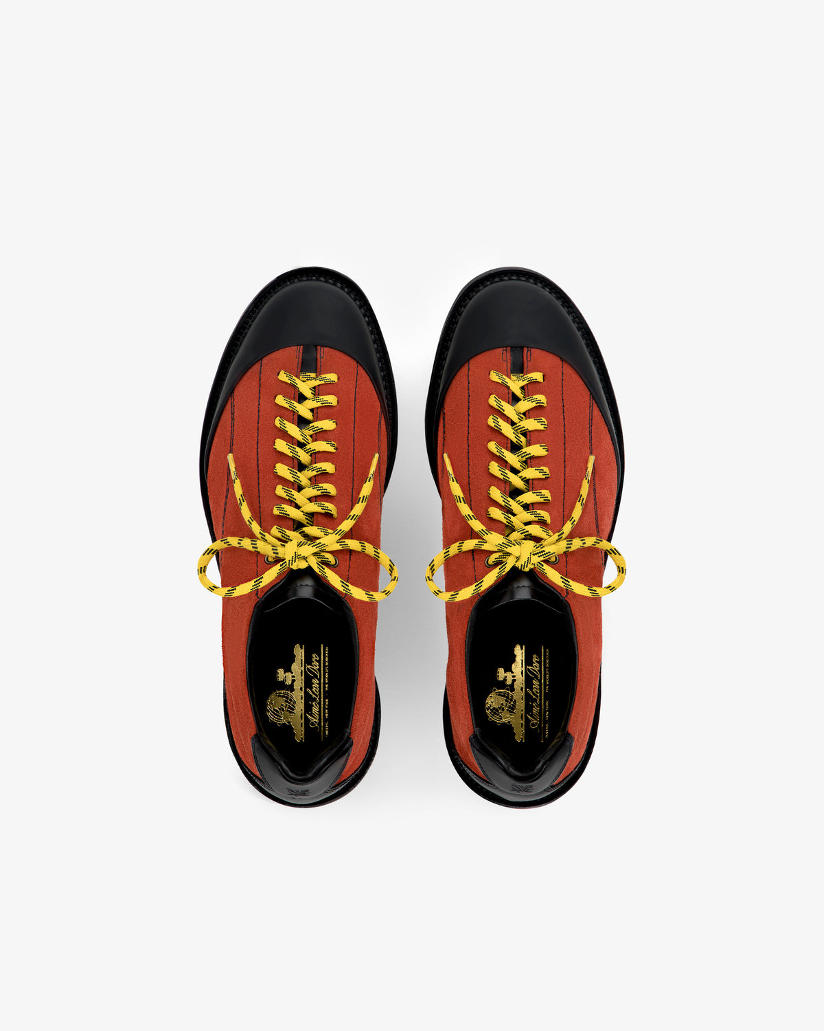 Top view of Suede Derby Hiker in red with black toes and yellow laces on a white background.
