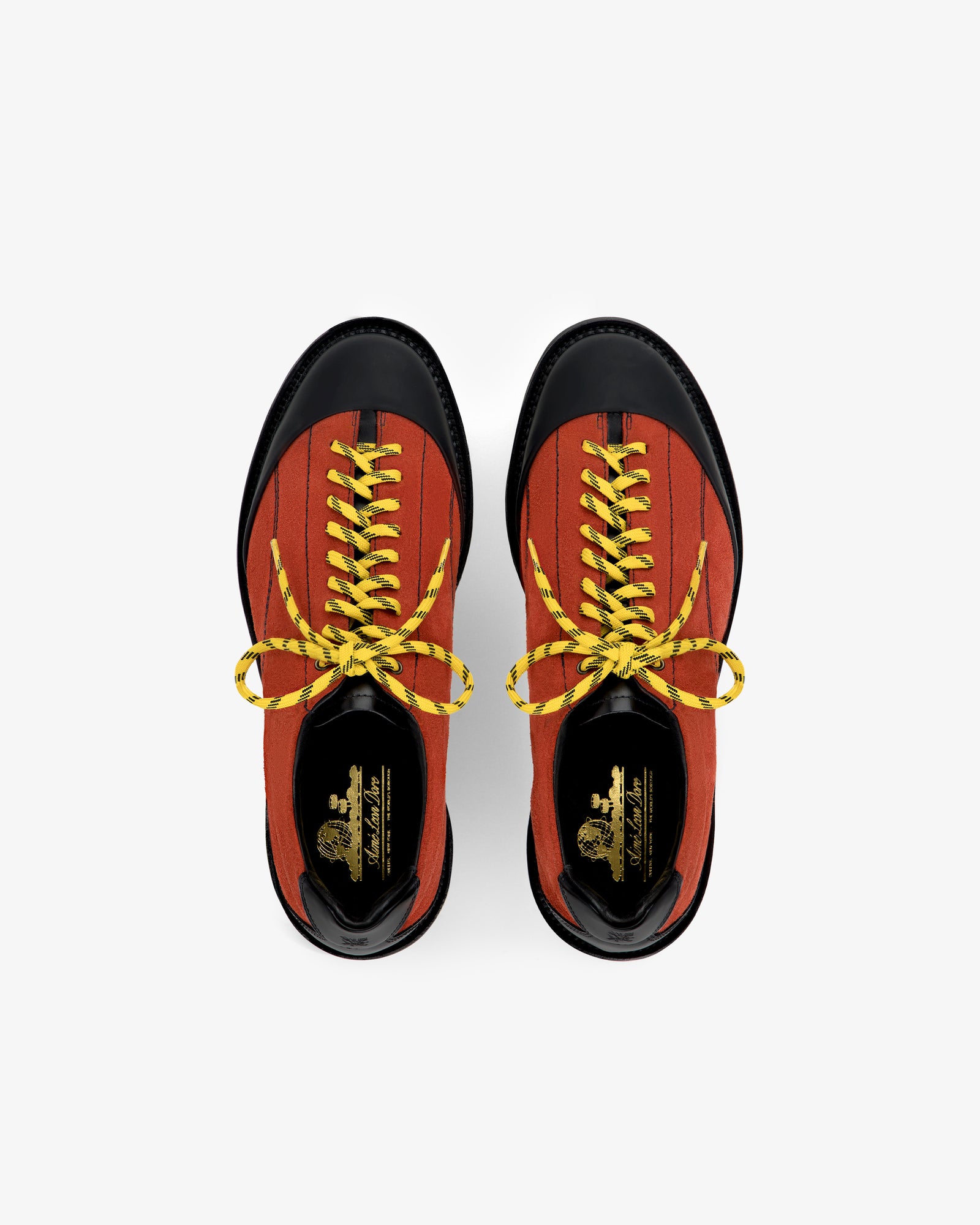 Top view of Suede Derby Hiker in red with black toes and yellow laces on a white background.