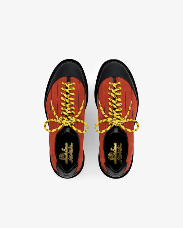Top view of Suede Derby Hiker in red with black toes and yellow laces on a white background.