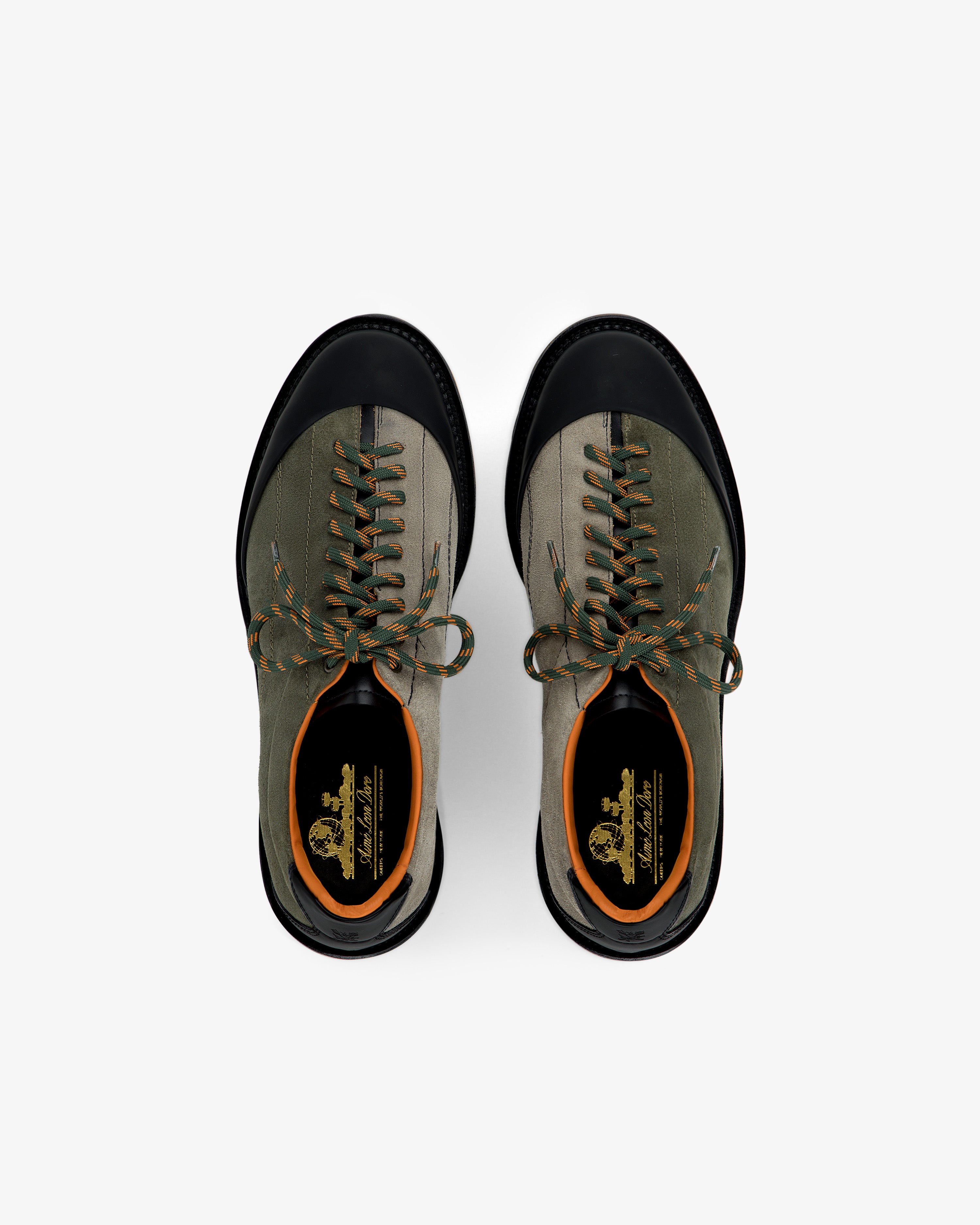 A pair of Suede Derby Hiker shoes in khaki and black with orange accents, shown from above on a white background.