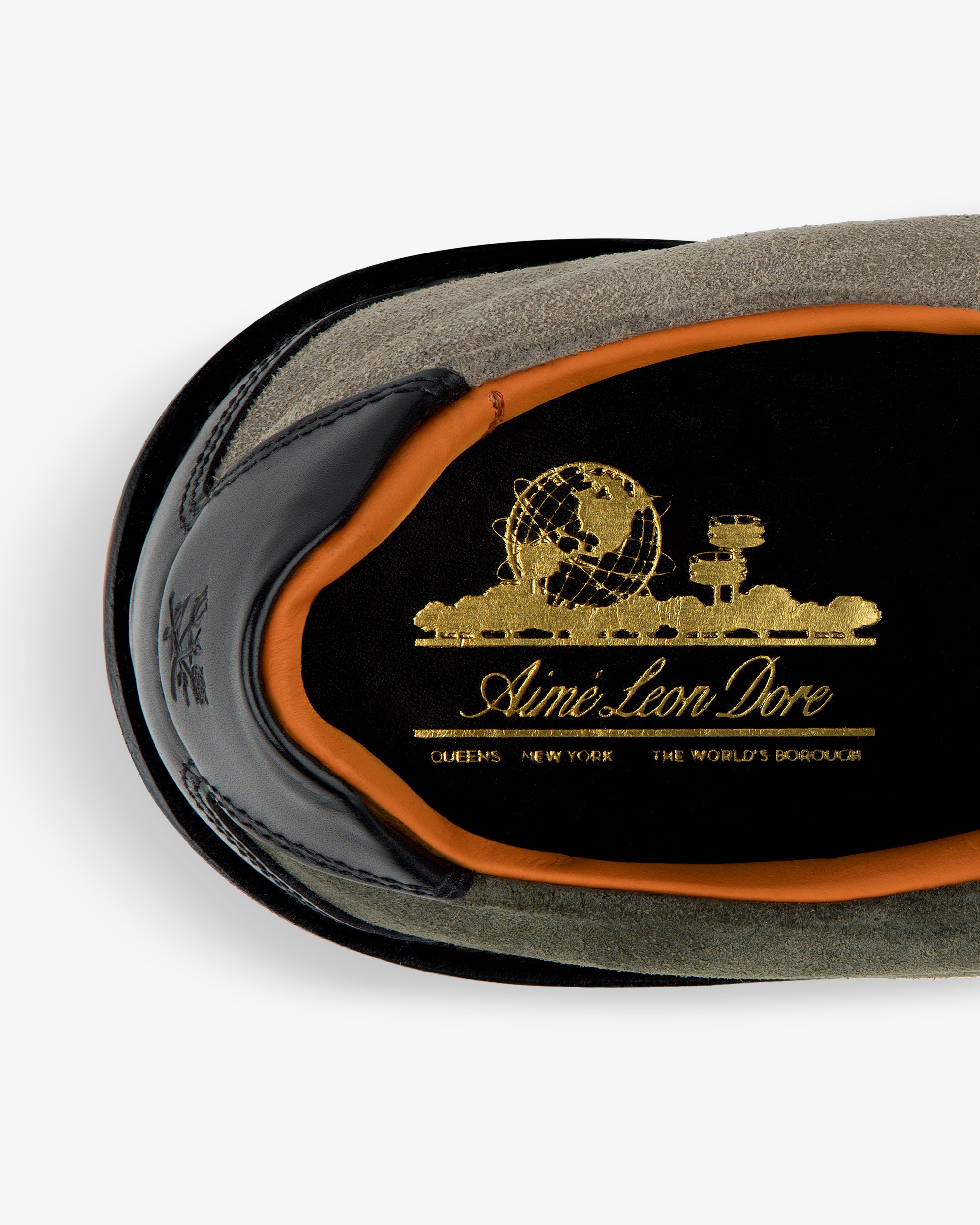 Top view of Suede Derby Hiker with gold Aimé Leon Dore logo on black insole, orange trim, and suede exterior.