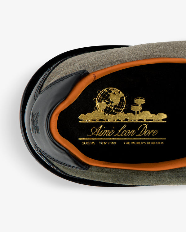 Top view of Suede Derby Hiker with gold Aimé Leon Dore logo on black insole, orange trim, and suede exterior.