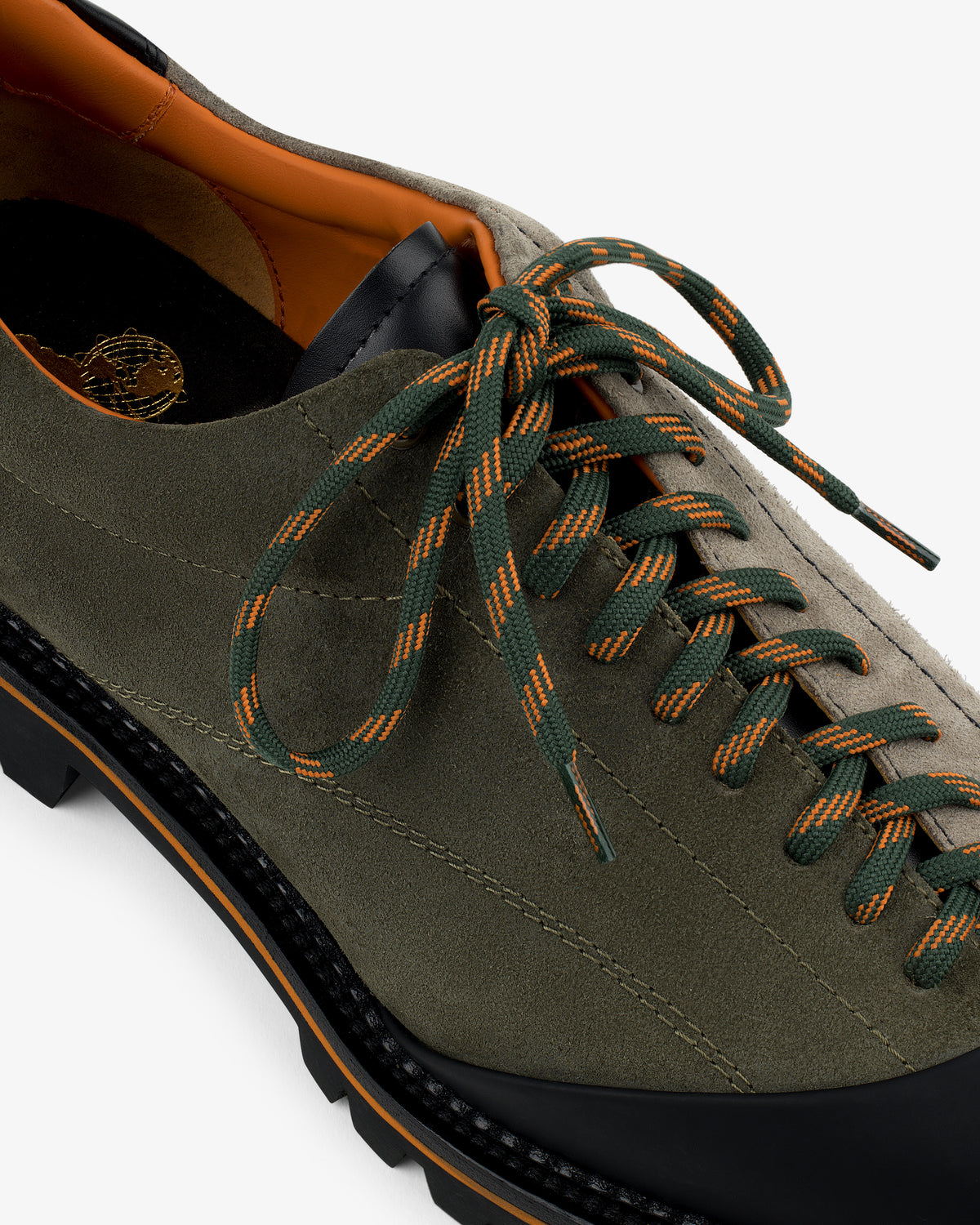 Top view of Suede Derby Hiker in olive green suede with black sole and green-orange striped laces.
