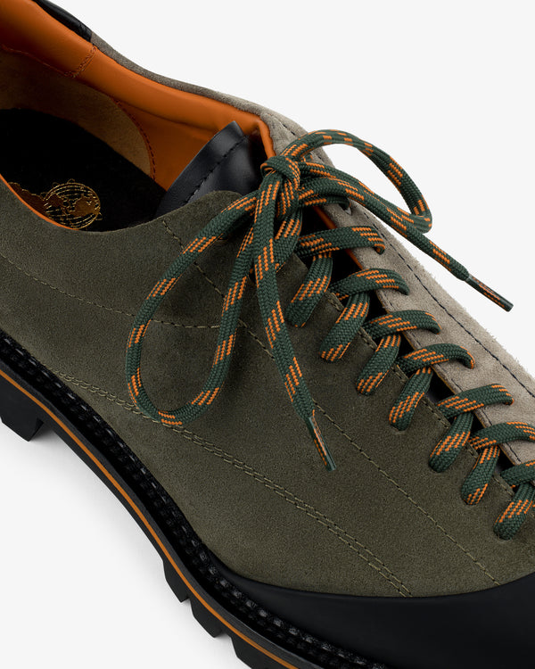 Top view of Suede Derby Hiker in olive green suede with black sole and green-orange striped laces.