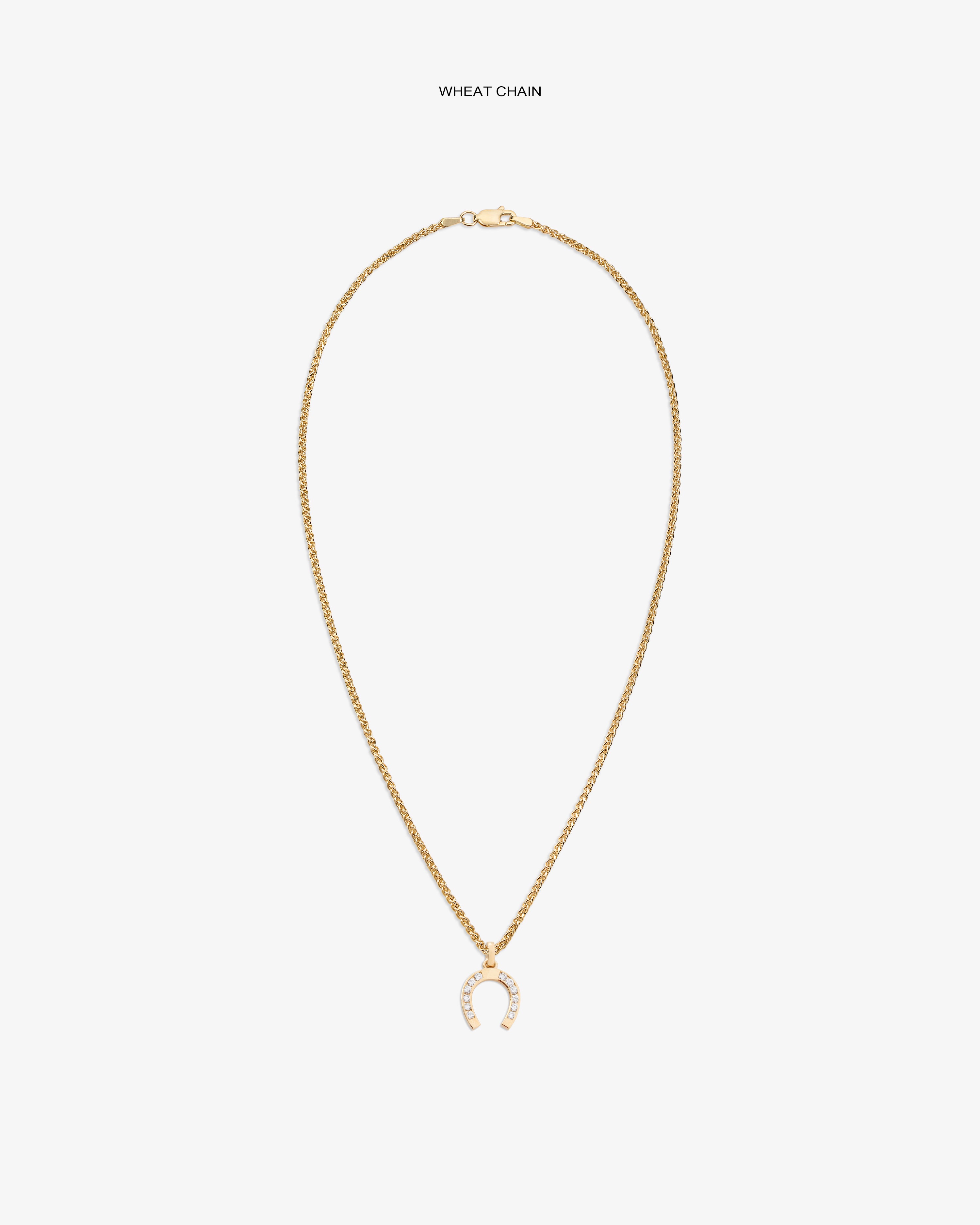Diamond Horseshoe Pendant on a gold wheat chain, shown against a plain white background.