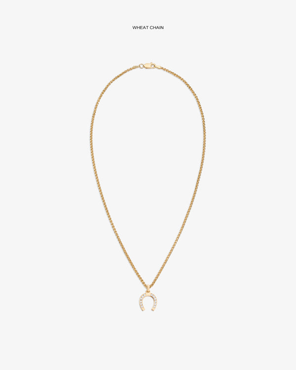 Diamond Horseshoe Pendant on a gold wheat chain, shown against a plain white background.