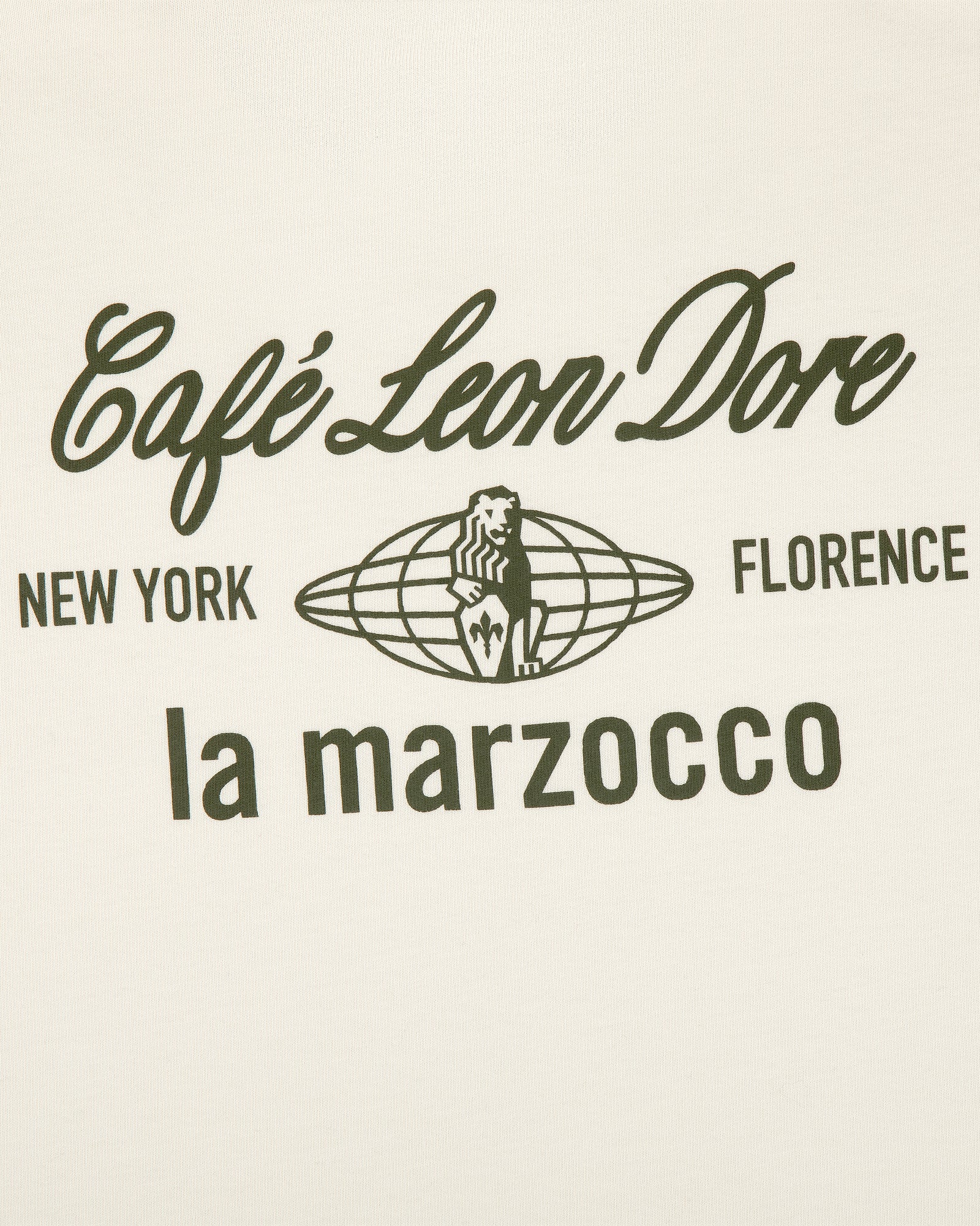White tee with black Café Leon Dore, New York, Florence, la marzocco text and lion logo at the center.