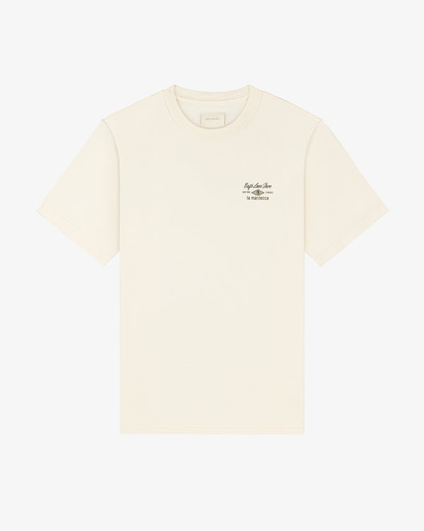 Café Leon Dore / La Marzocco Tee in off-white with small black text on the left chest, shown on a white background.