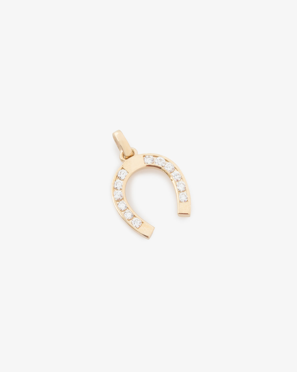 Diamond Horseshoe Pendant featuring small round diamonds set along the curve, displayed on a white background.