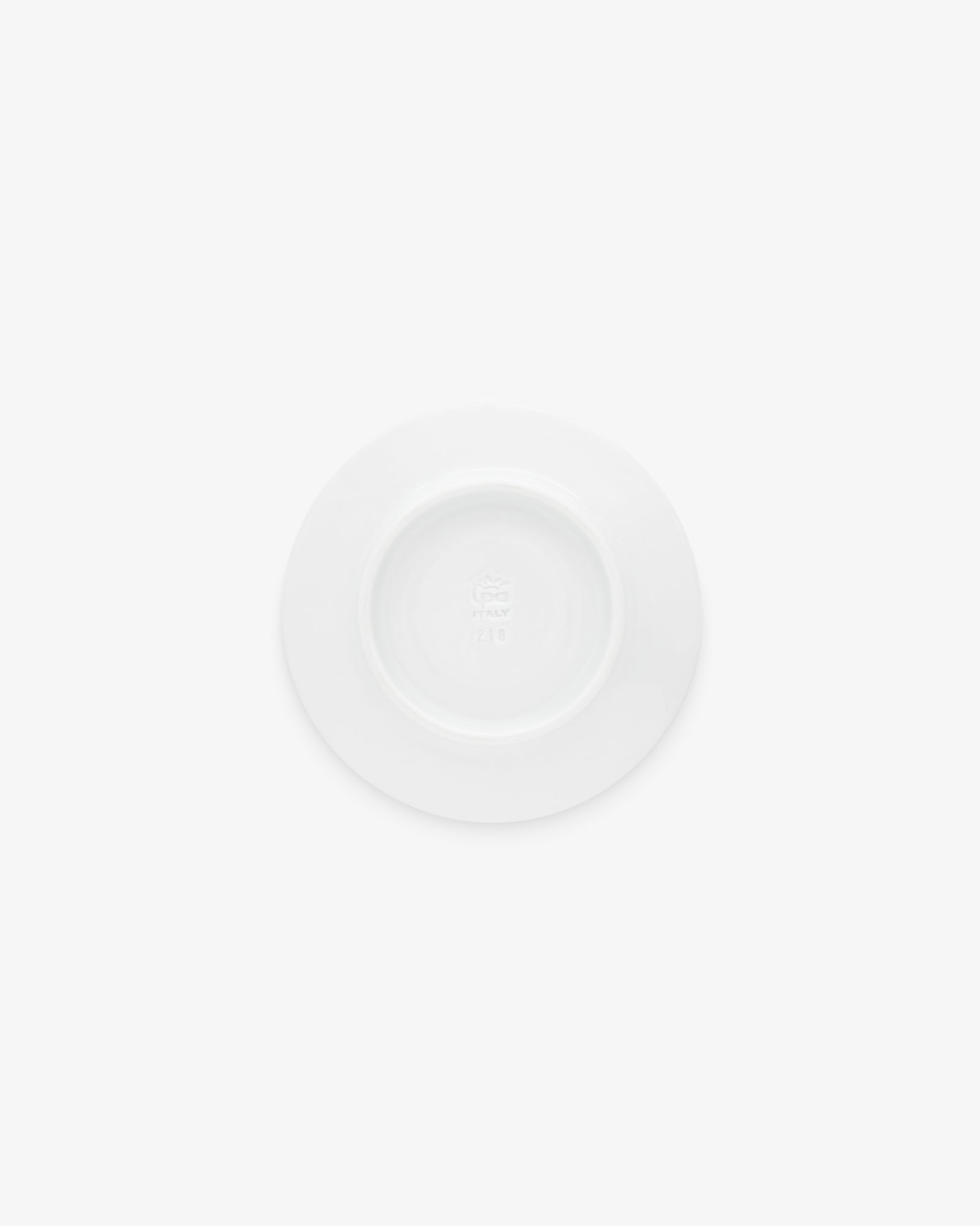 A Café Leon Dore Espresso Saucer, ceramic and white, shown from above on a white background.