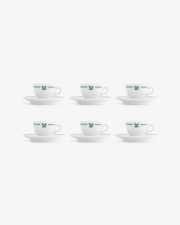 Set of 6 Café Leon Dore espresso cups & saucers, white with blue stripes and floral design, arranged in two rows.