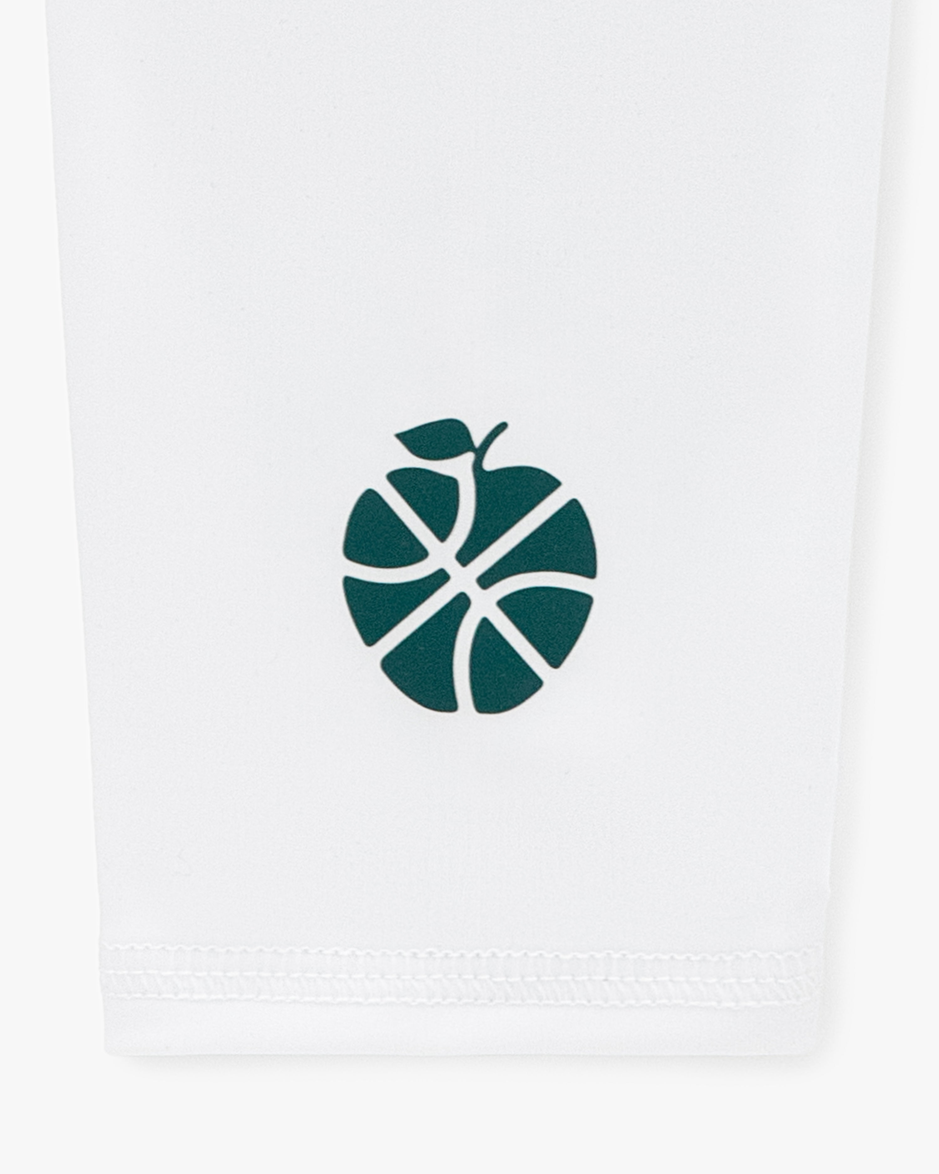 A green basketball-apple logo on white fabric features on the ALD / New Balance SONNY NY Calf Sleeves.