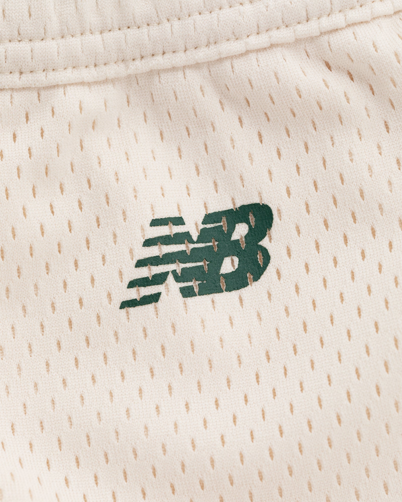 Green New Balance logo on cream perforated athletic fabric of ALD / New Balance SONNY NY Gym Short.