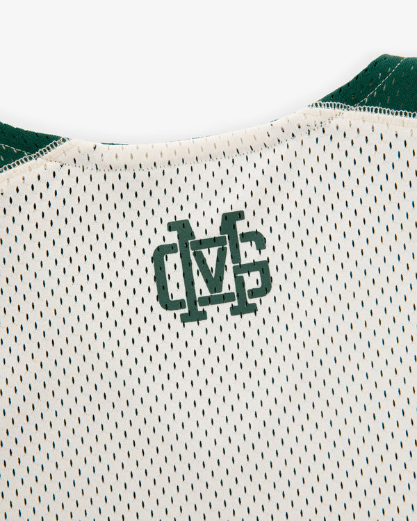 Close-up of the ALD / New Balance SONNY NY Reversible Jersey's back neck with green overlapping “MS” letters.