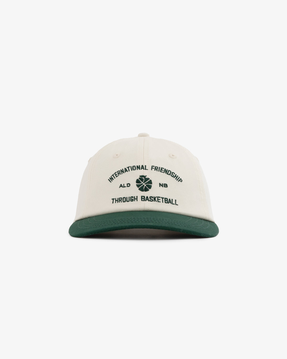 ALD / New Balance SONNY NY IFTB Hat: white cap, green brim, "International Friendship Through Basketball" text, basketball graphic.