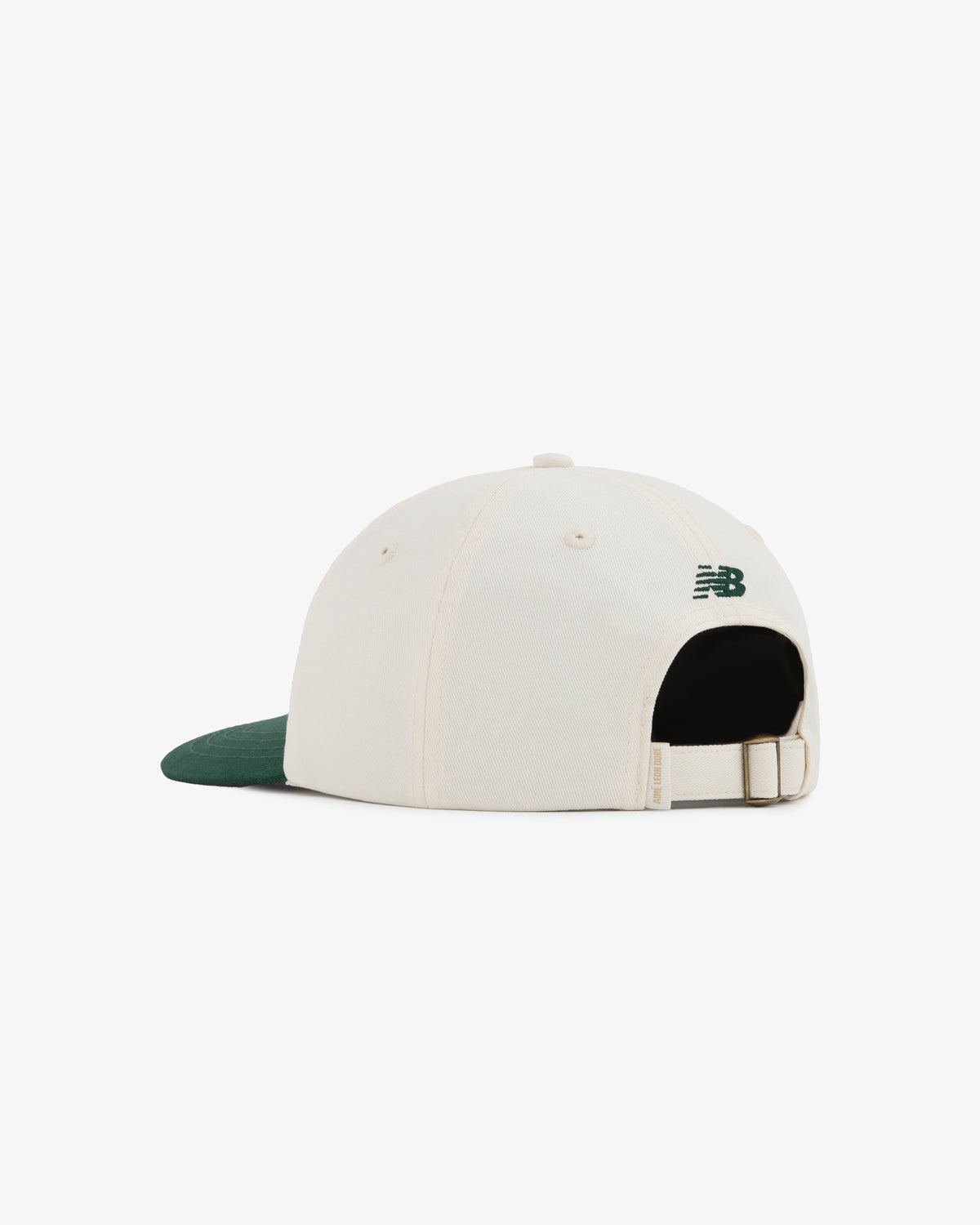 The ALD/New Balance SONNY NY IFTB Hat is white with a dark green brim, back strap, and New Balance logo.