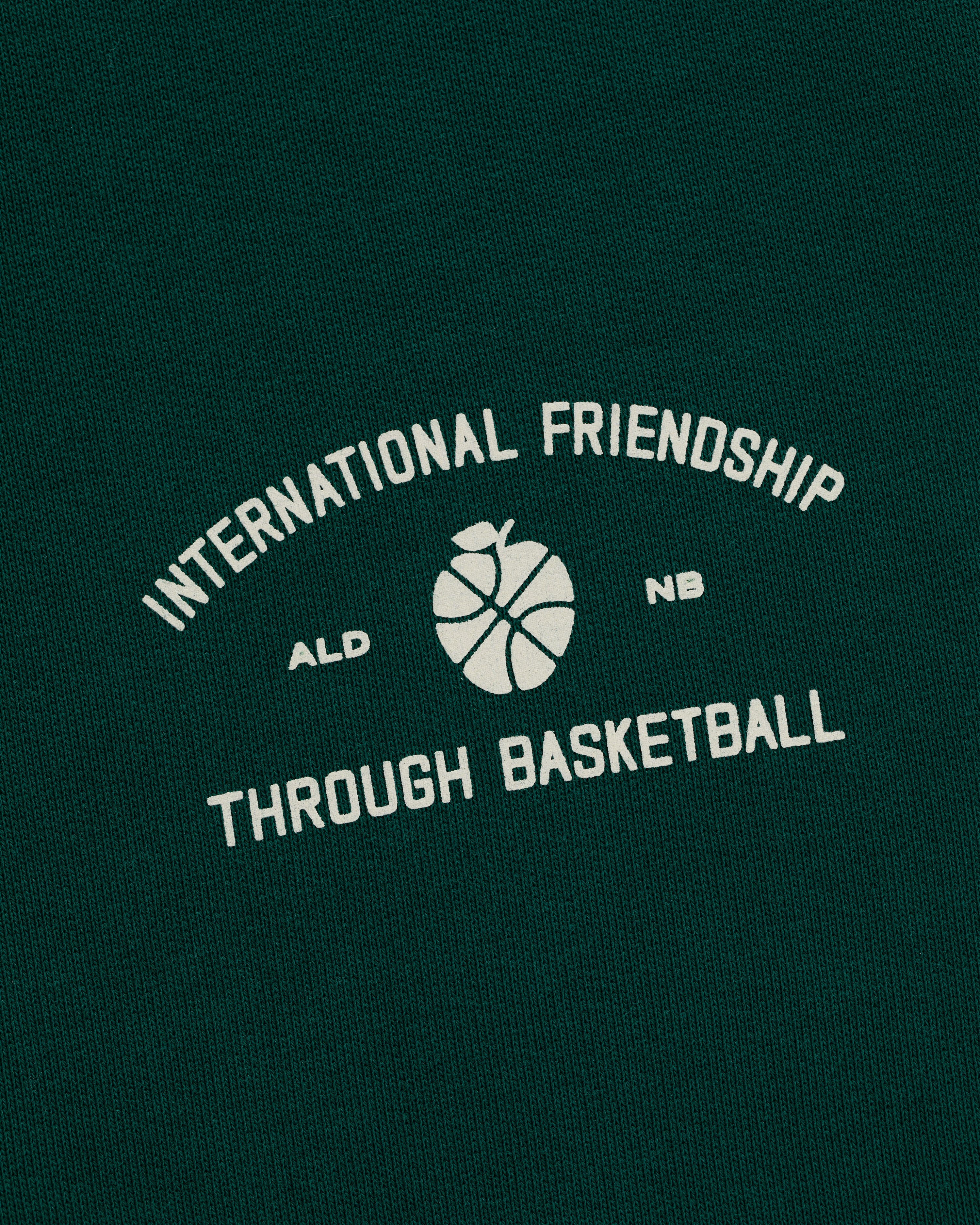 ALD / New Balance SONNY NY IFTB Crewneck Sweatshirt: green with International Friendship Through Basketball text and graphic.