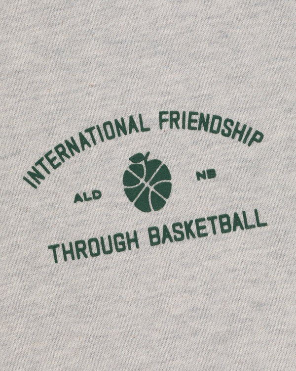 Gray ALD/New Balance SONNY NY IFTB Crewneck with green "International Friendship Through Basketball" text.