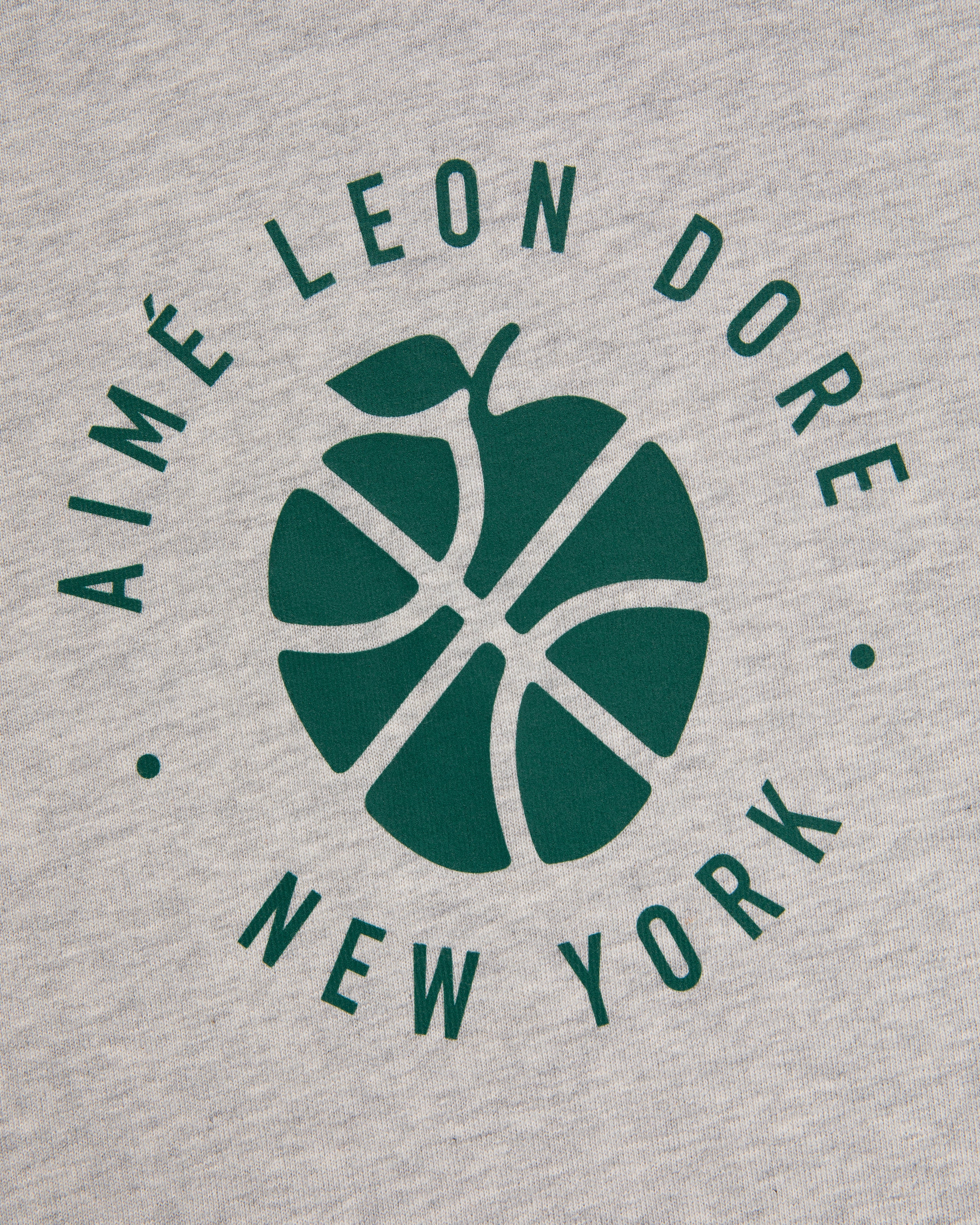 Green basketball-apple logo with Aimé Leon Dore New York text on gray ALD / New Balance SONNY NY Long-Sleeve Tee.
