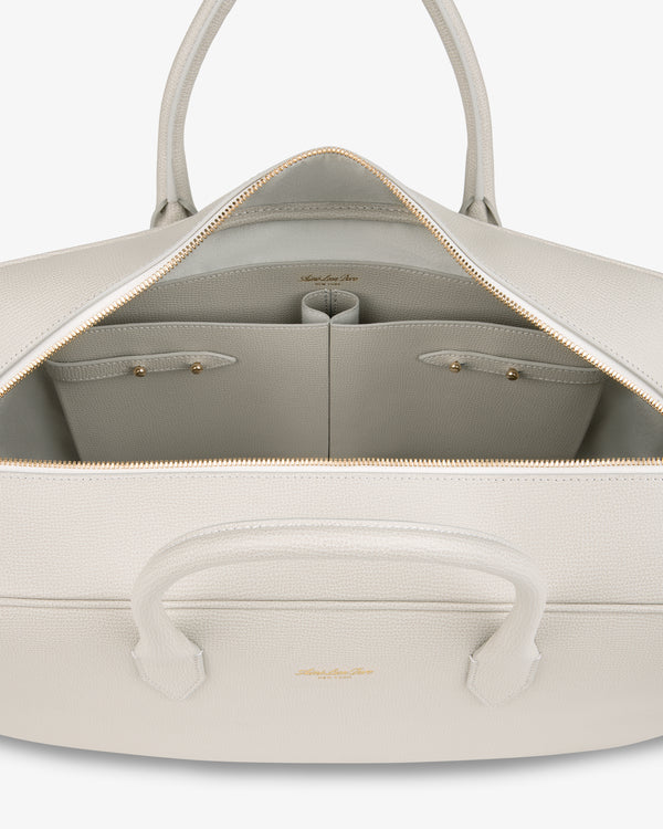 Open Full Grain Leather Briefcase Duffle showing roomy interior with two small pockets and a gold zipper.