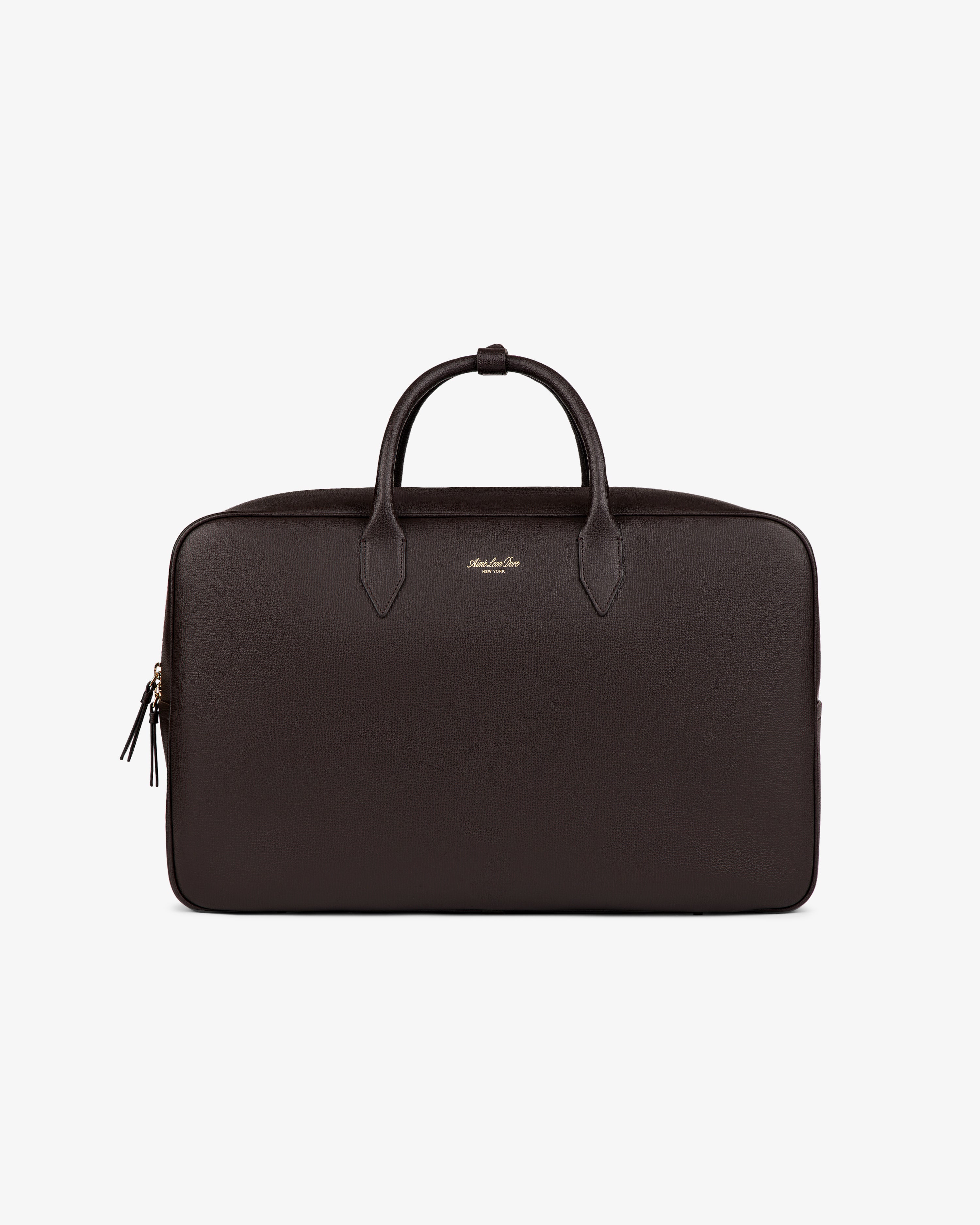 The Full Grain Leather Briefcase Duffle in black with two handles and a zipper is shown on a plain white background.