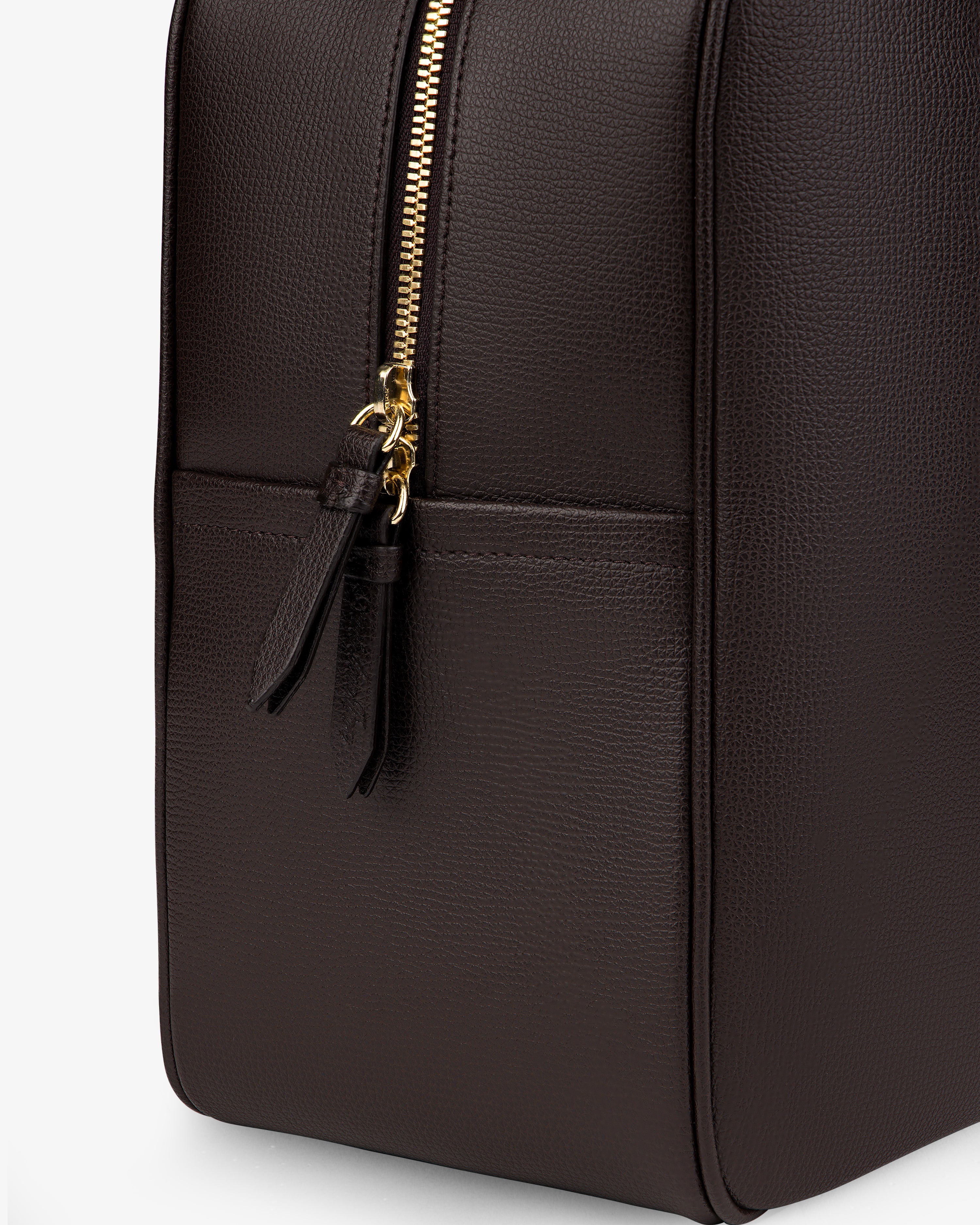 Close-up of the Full Grain Leather Briefcase Duffle with a gold zipper and two leather pulls on a plain light background.