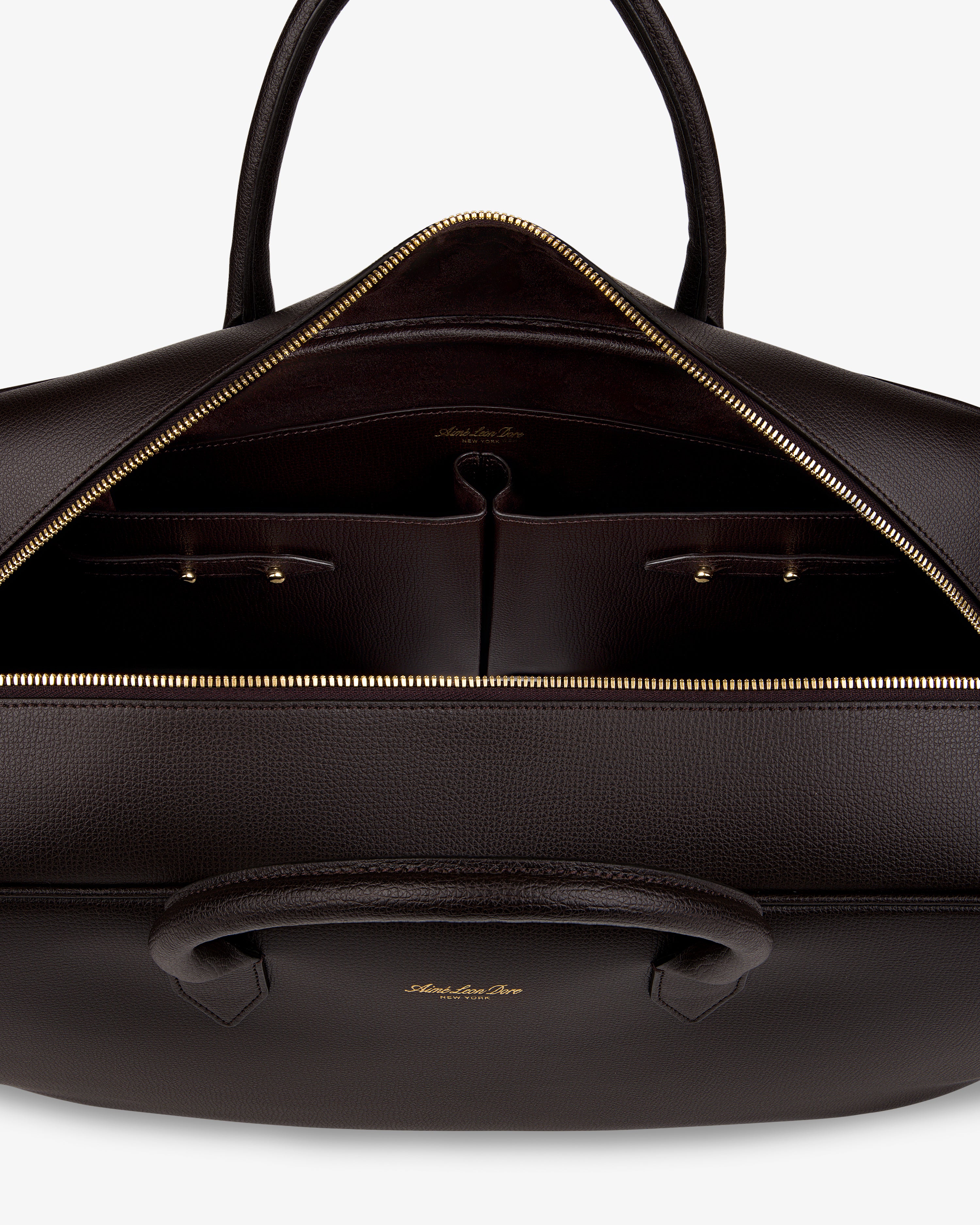A Full Grain Leather Briefcase Duffle with gold zipper, organized interior pockets, and dual handles.