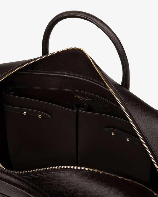 Open Full Grain Leather Briefcase Duffle with gold zipper, showing interior pockets and embossed logo.
