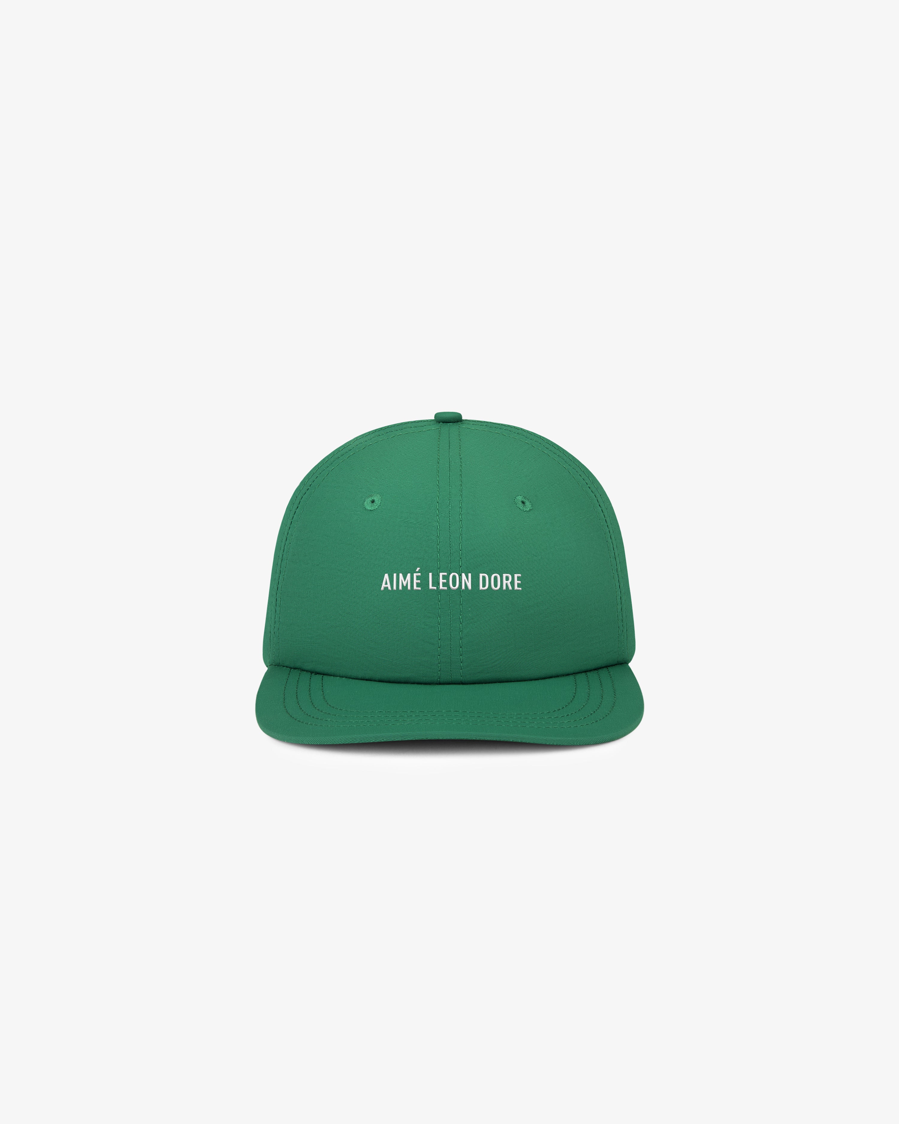 Green Nylon Sport Hat with AIMÉ LEON DORE text in white, shown on a plain white background.