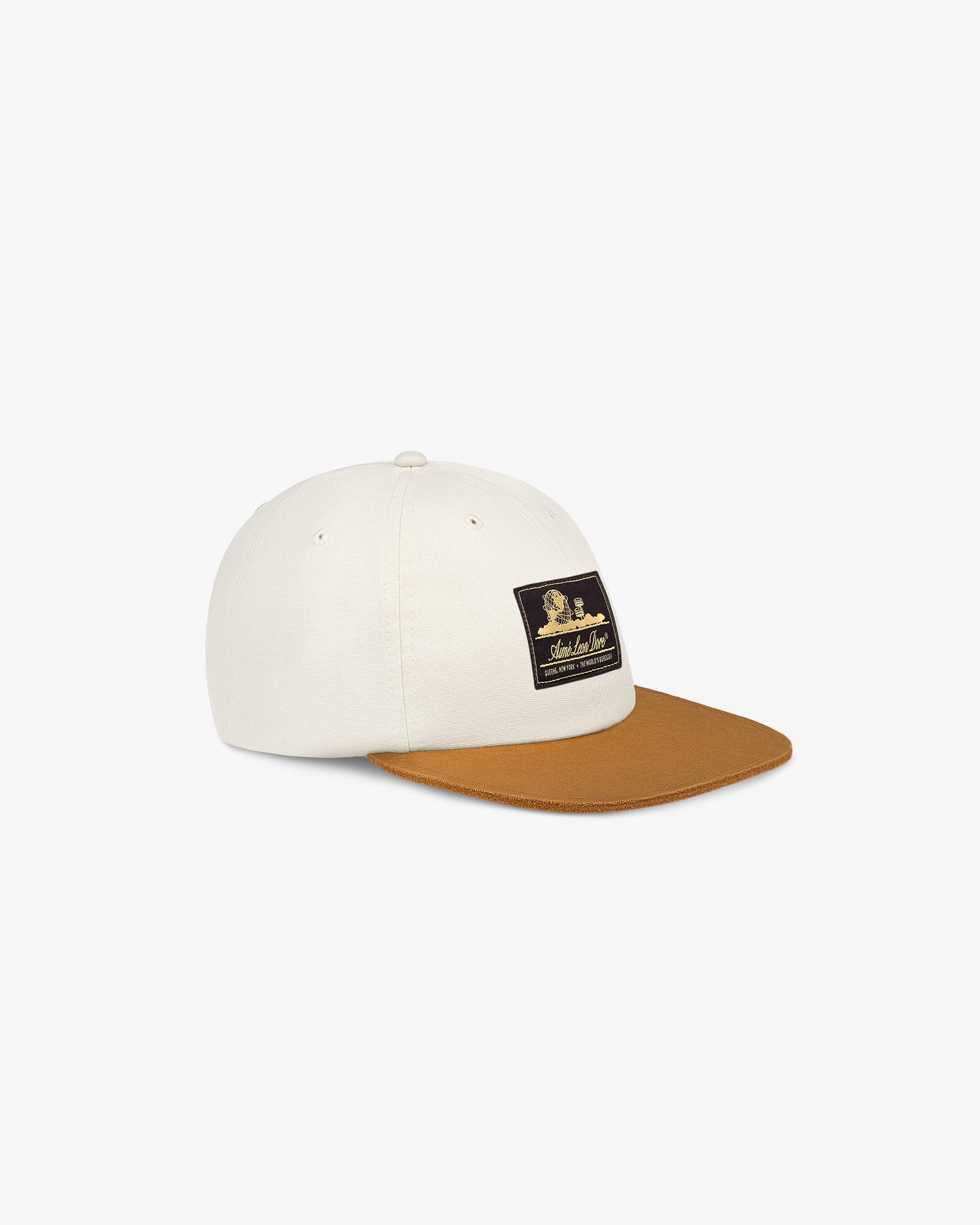 Unisphere Label Hat: white cap with brown brim and black patch, displayed on a white background.