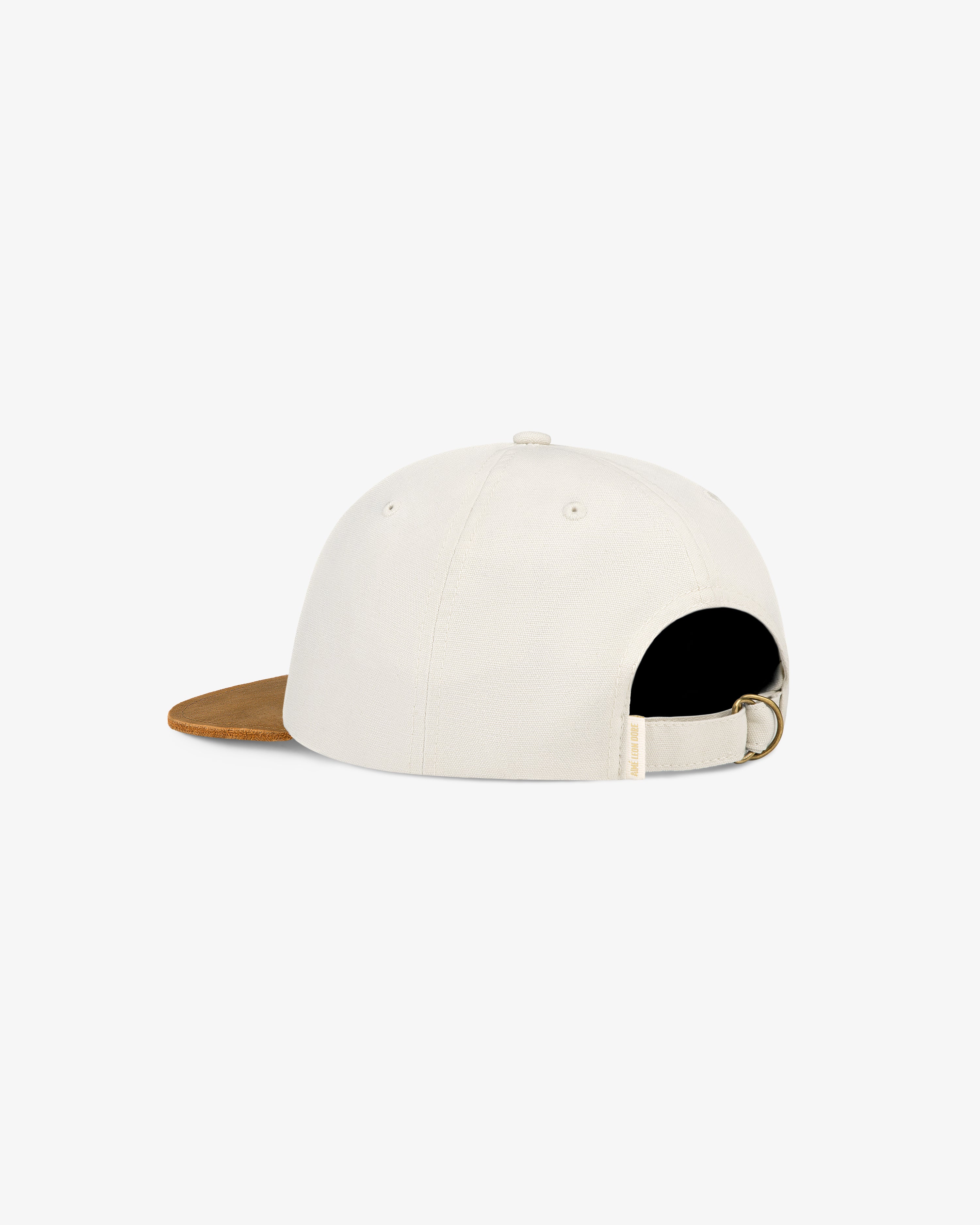 Unisphere Label Hat, white with brown brim, back view featuring adjustable strap and metal buckle.