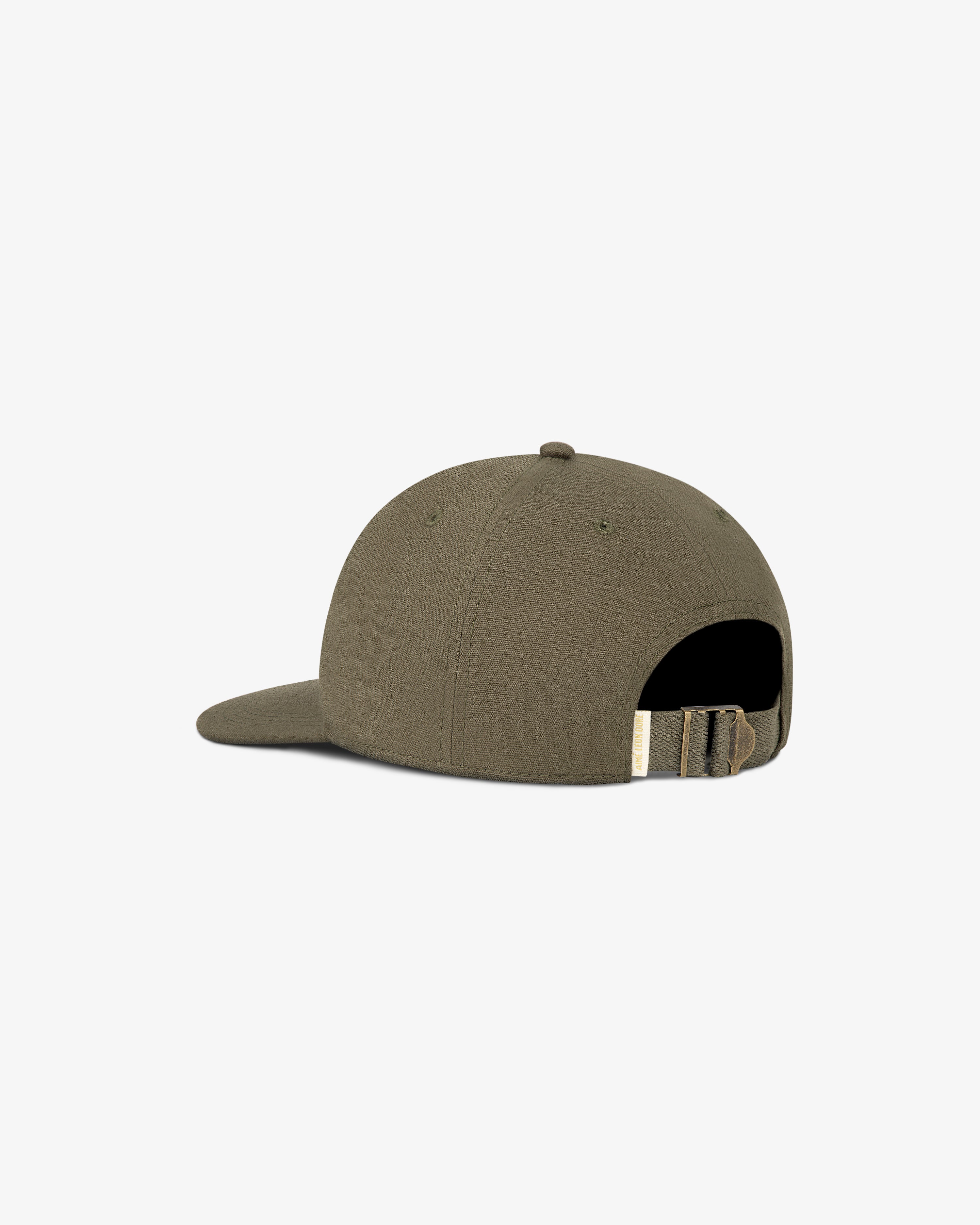 Triborough Dry Goods Hat in olive green, shown from back with adjustable strap and metal buckle.