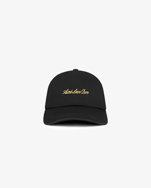 Washed Script Hat in black with gold embroidered Aimé Leon Dore script on the front, shown on a white background.