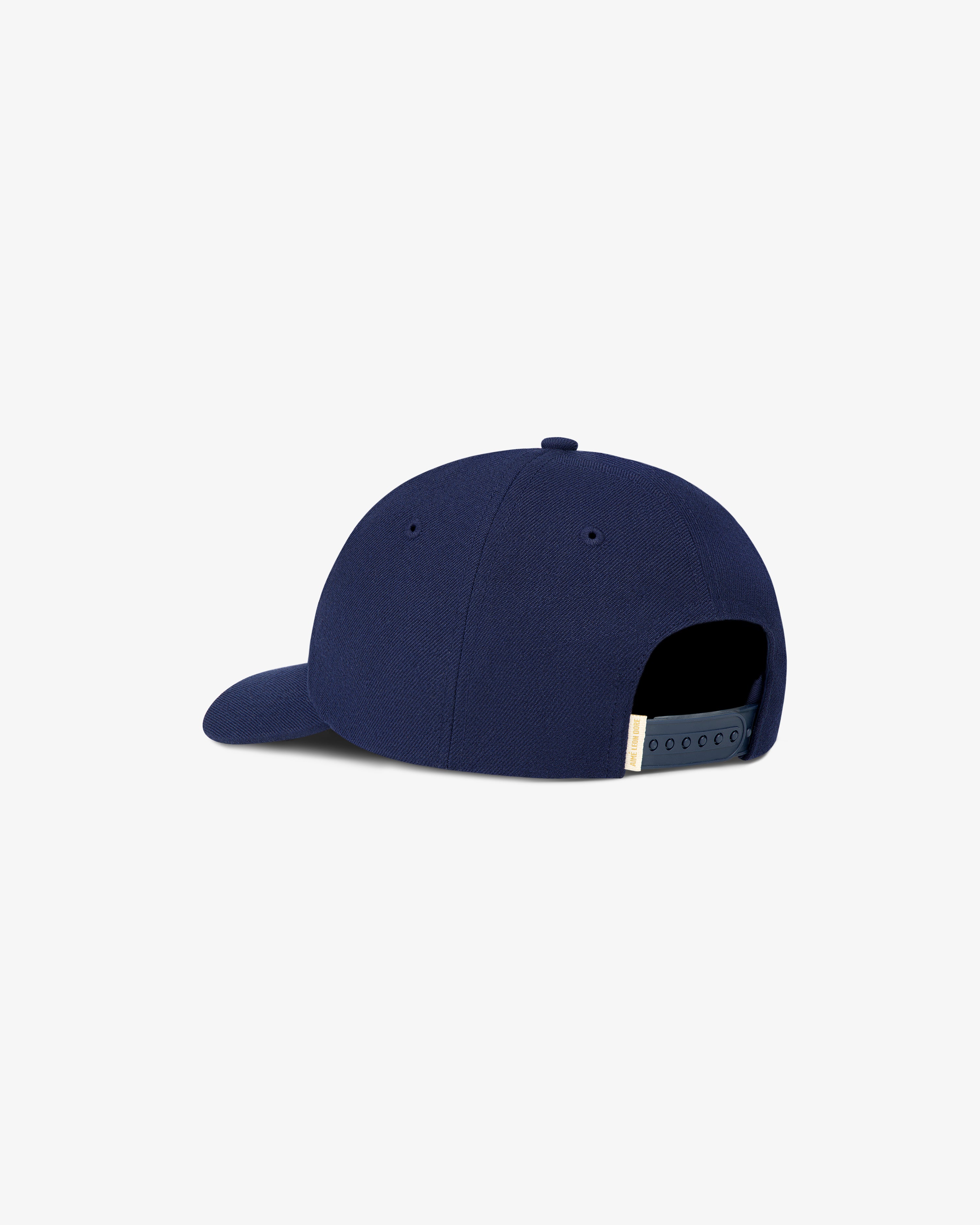 The Aimé Campus Hat in navy, shown from the back with an adjustable snapback closure.