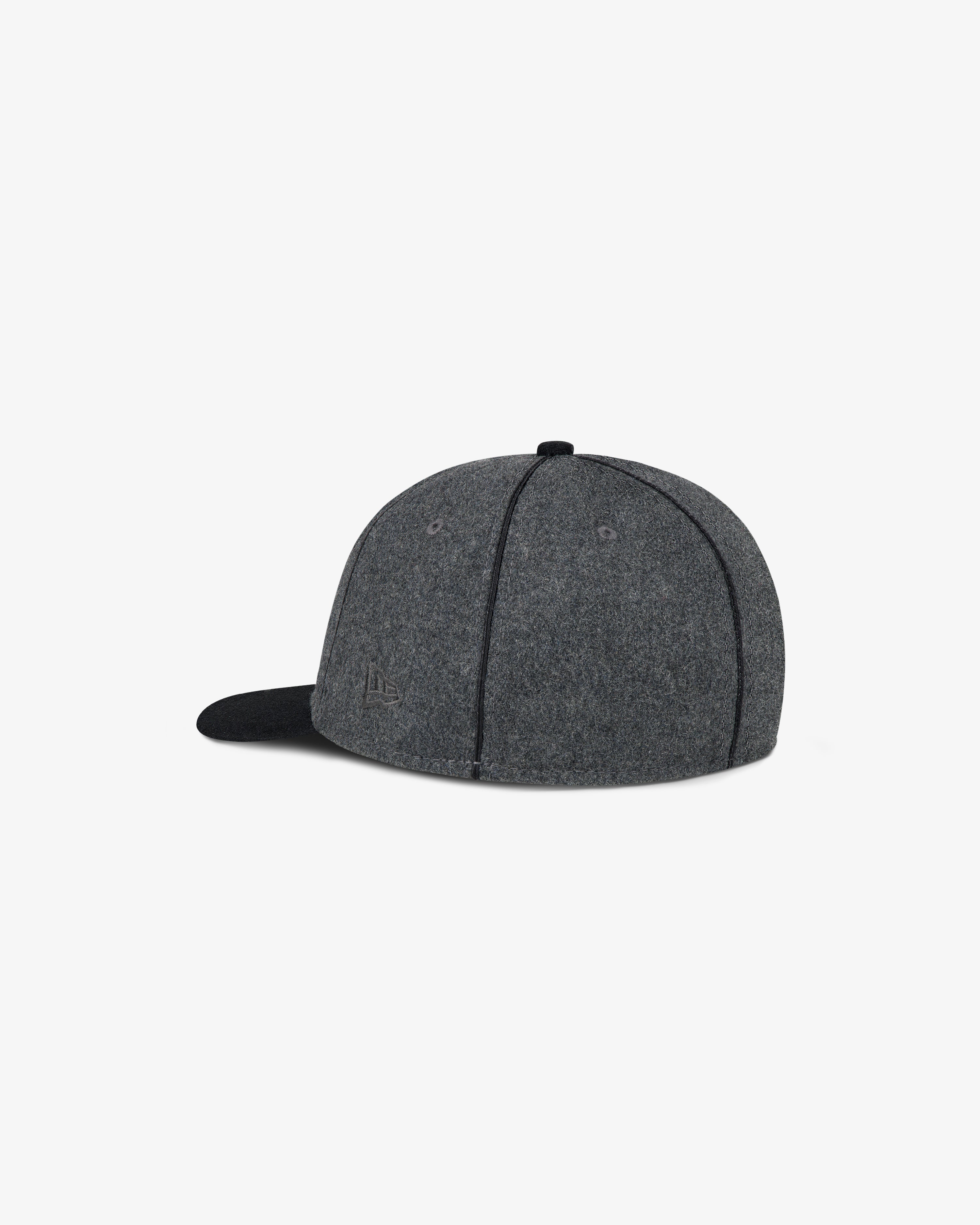 ALD / New Era Mets Melton Wool Fitted Hat shown back left, gray with black brim, on a white background.