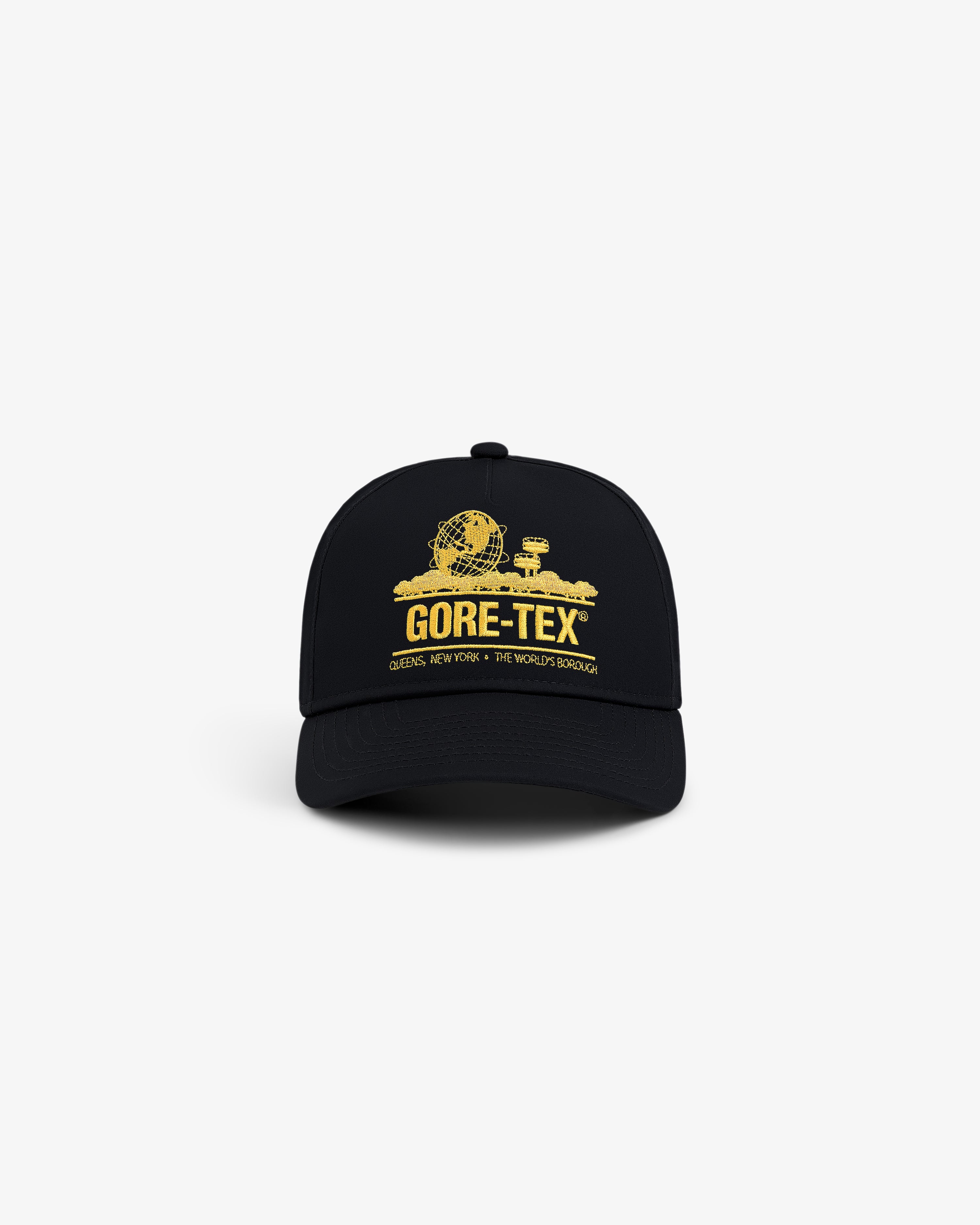The GORE-TEX Unisphere Hat is a black cap with a yellow globe and buildings graphic plus GORE-TEX text on the front.