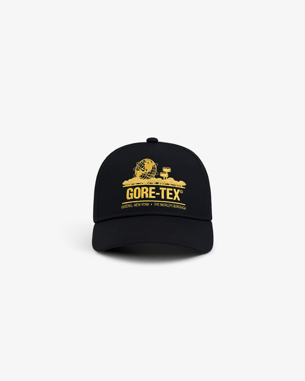 The GORE-TEX Unisphere Hat is a black cap with a yellow globe and buildings graphic plus GORE-TEX text on the front.