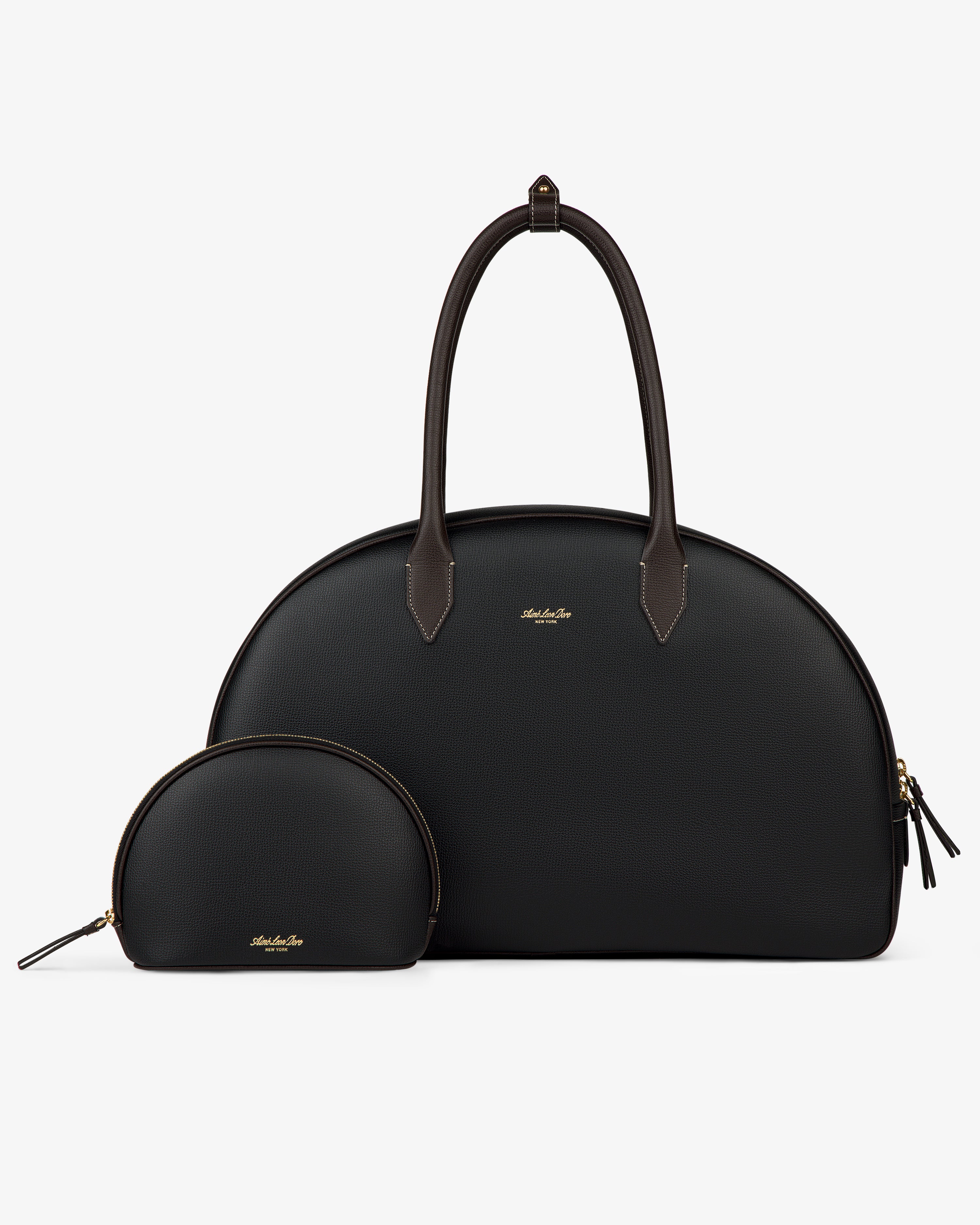 Two Full Grain Leather Crescent Shoulder Bags, one large and one small, black with gold zippers on a white background.