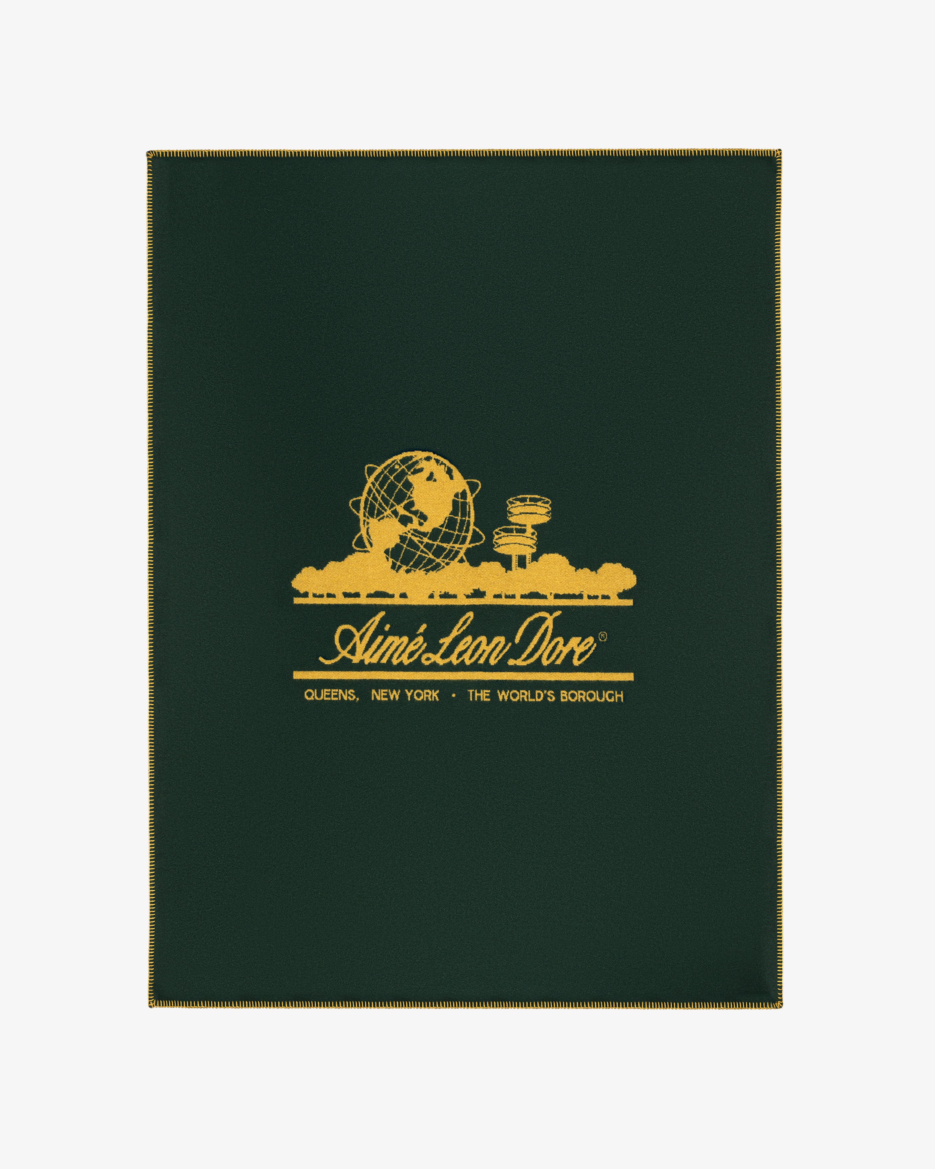 Unisphere Wool Blanket in dark green with gold Unisphere, buildings, and Aimé Leon Dore branding with location details.