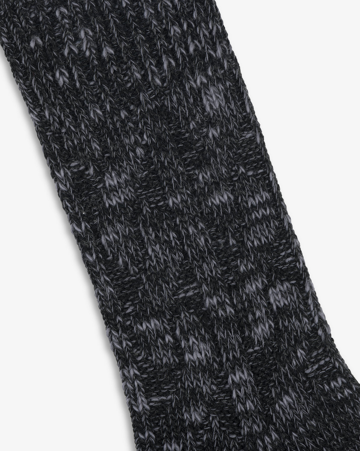 Close-up of a black and gray Cable Knit Hiking Sock featuring a textured, ribbed pattern.