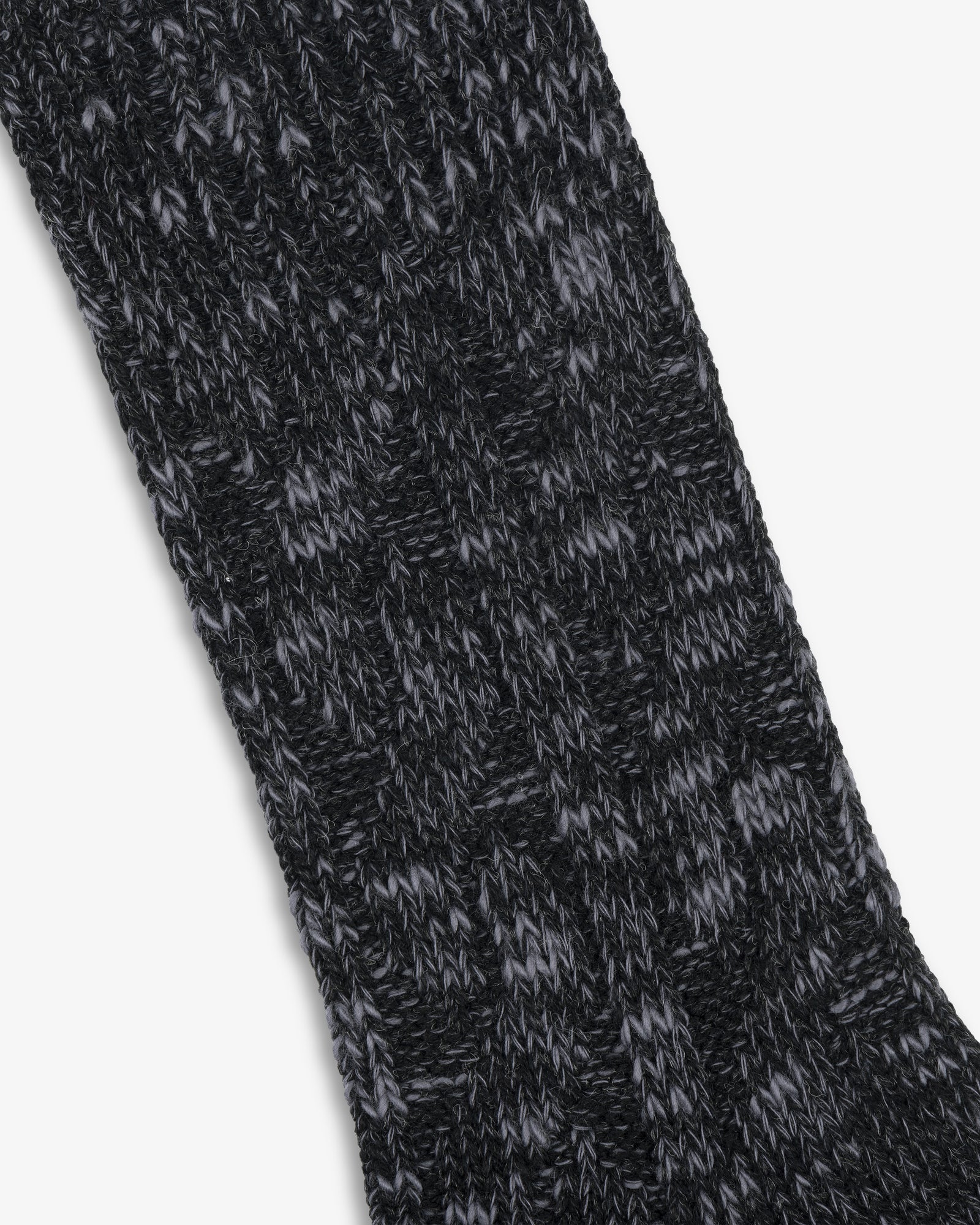 Close-up of a black and gray Cable Knit Hiking Sock featuring a textured, ribbed pattern.