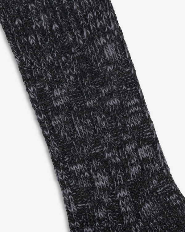 Close-up of a black and gray Cable Knit Hiking Sock featuring a textured, ribbed pattern.