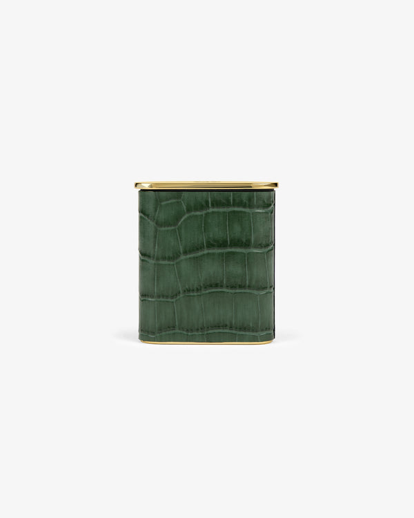 The Queens Crest Croc Portable Ashtray is a square green container with a crocodile texture and gold lid on white background.