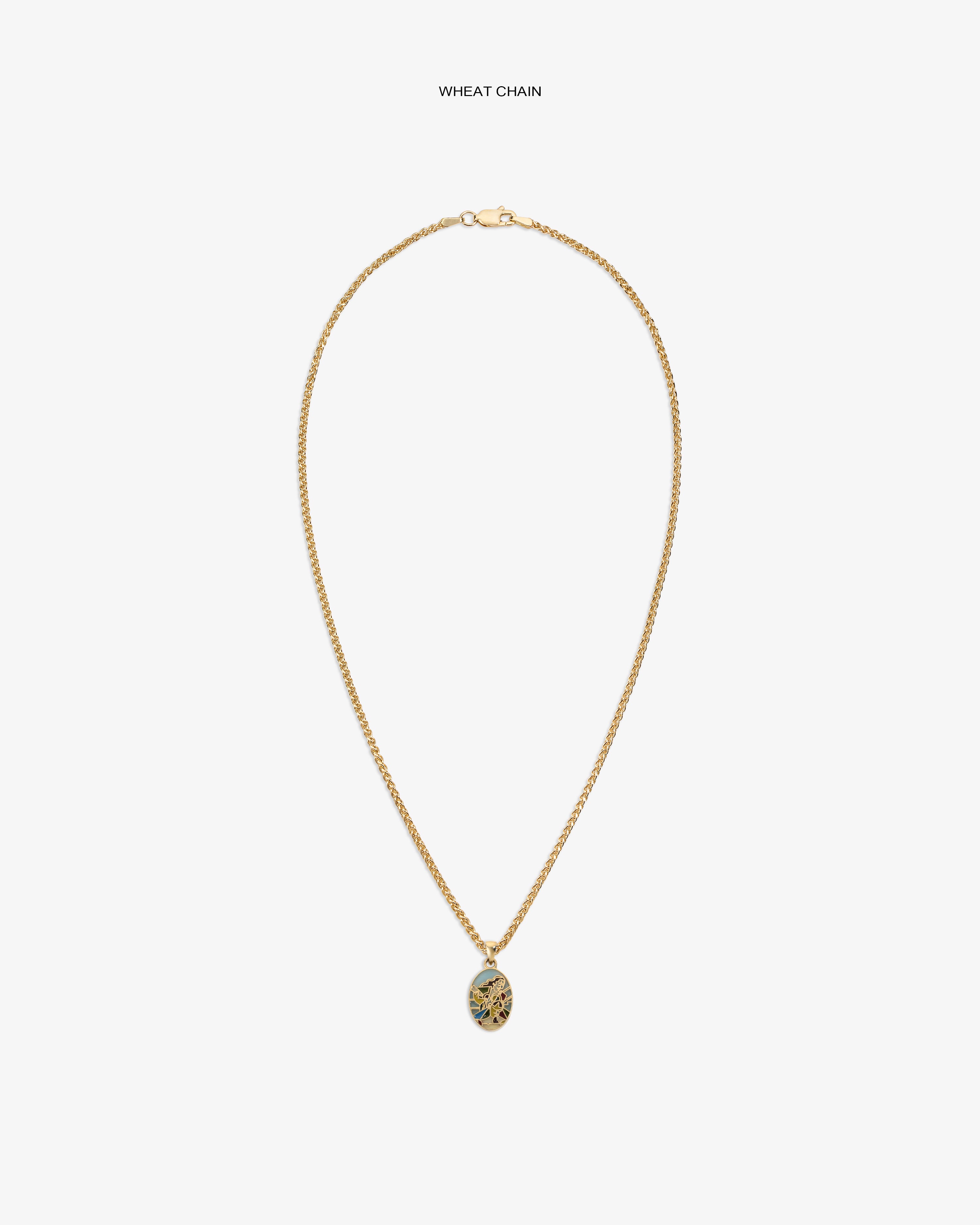 14Kt Gold Molina Pendant on a wheat chain with an intricate oval design, shown against a white background.