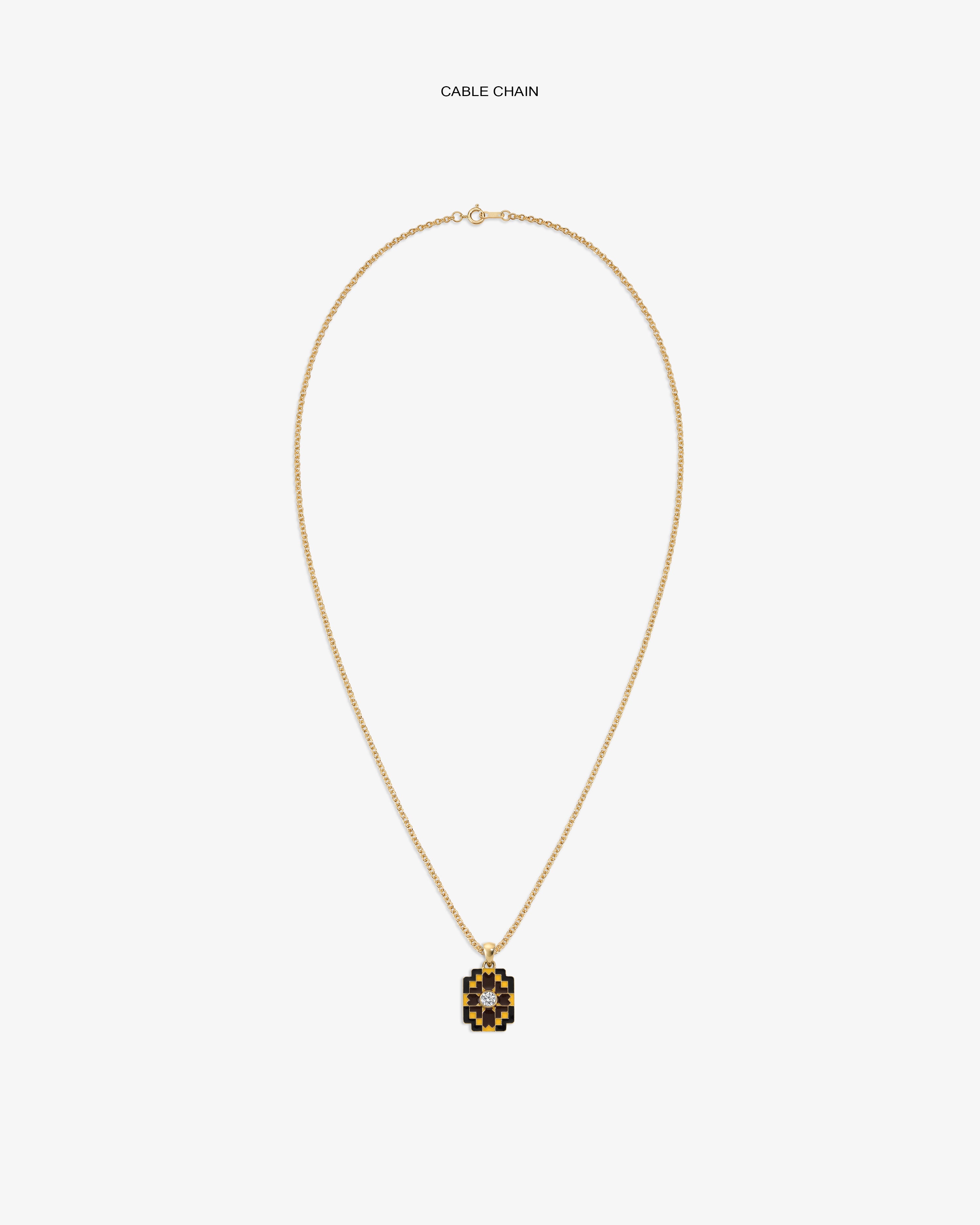 Diamond Mosaic Pendant on a gold cable chain, featuring black and gold, displayed against a white background.