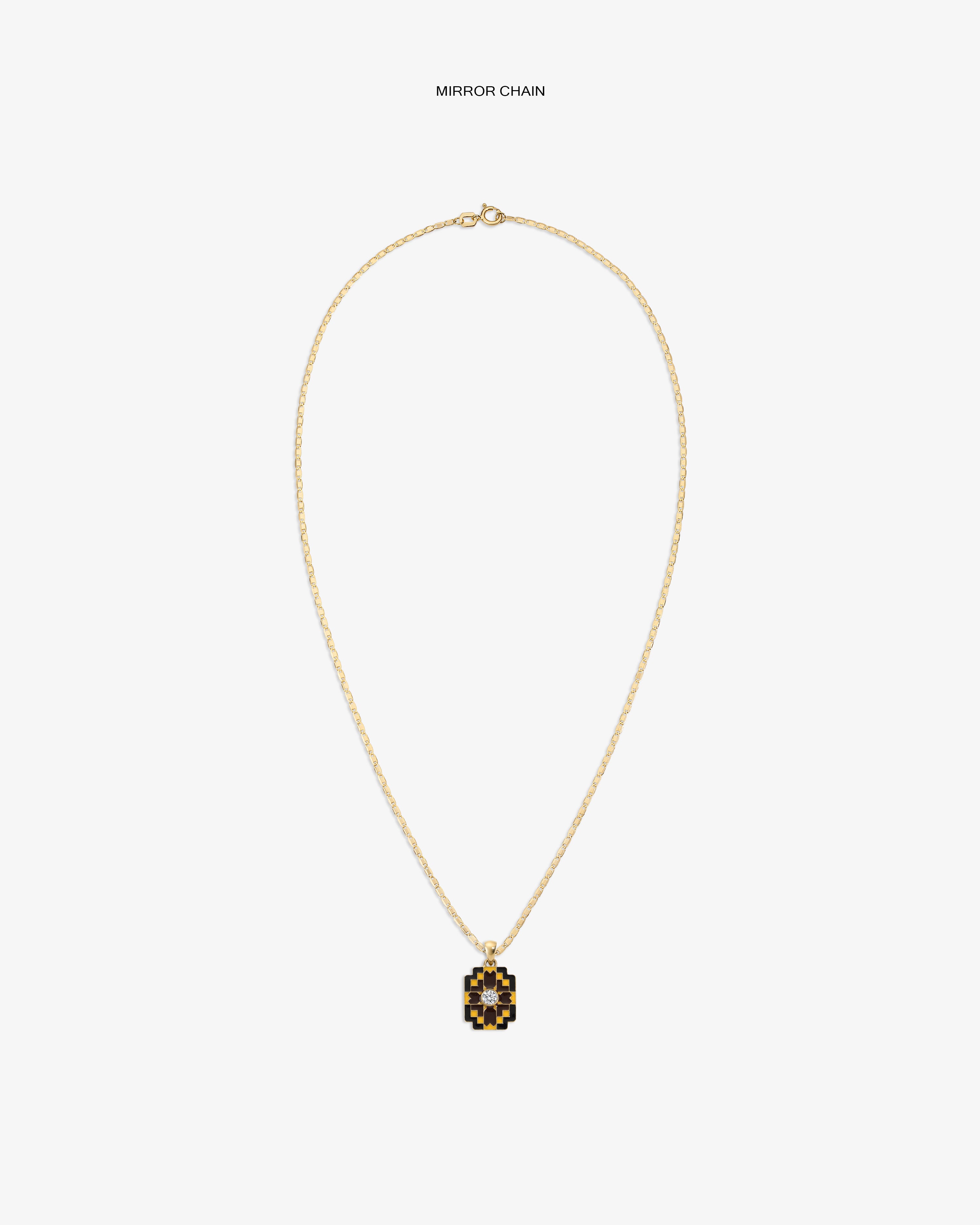 Diamond Mosaic Pendant: a gold chain necklace with a geometric black and gold pendant on white background.