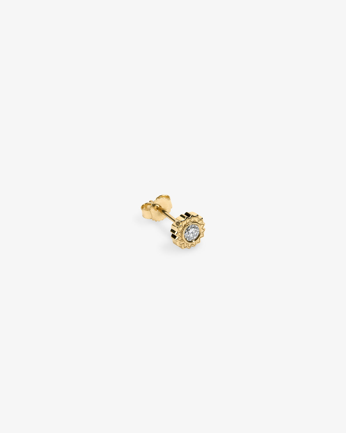 Hēlios Diamond Earring: small gold stud with a round, clear diamond in a decorative setting on white background.