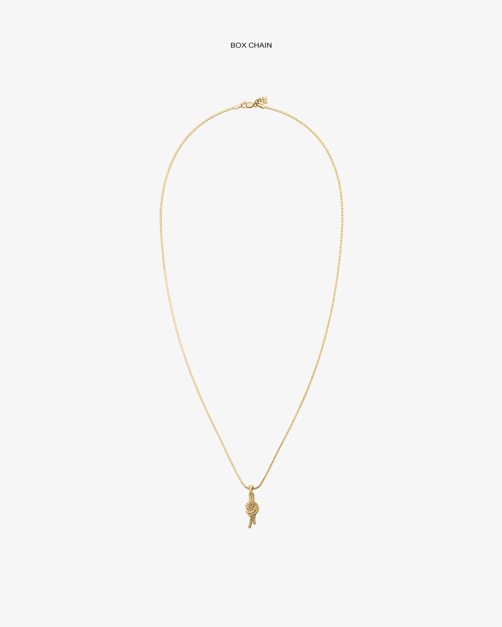 A 14Kt gold box chain necklace with a nautical knot pendant, displayed on a plain white background.