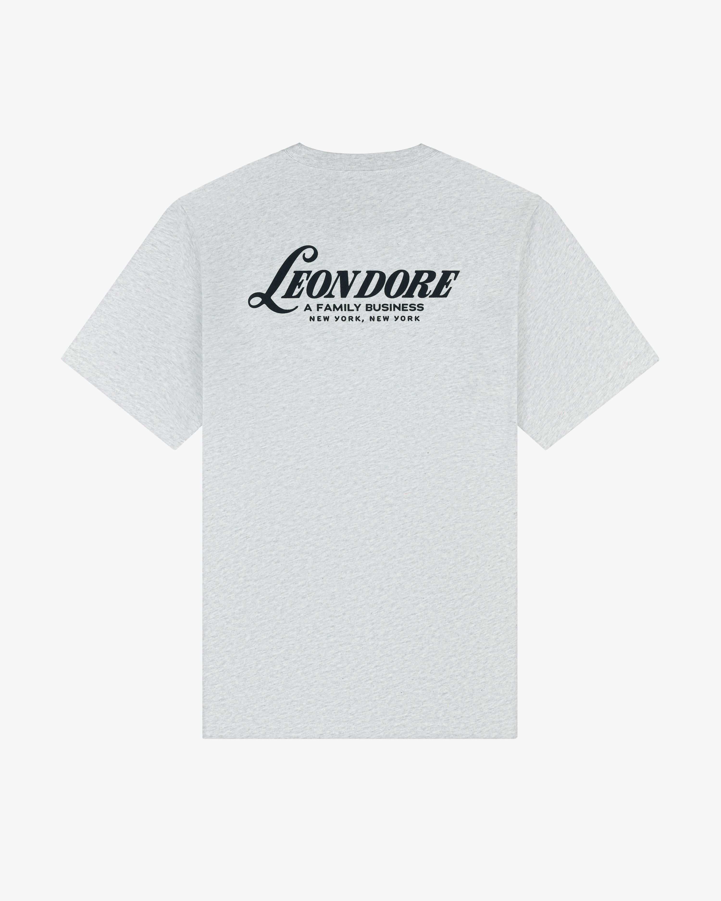 Light gray Leon Dore Tee with "A FAMILY BUSINESS NEW YORK, NEW YORK" printed in black on the upper back.
