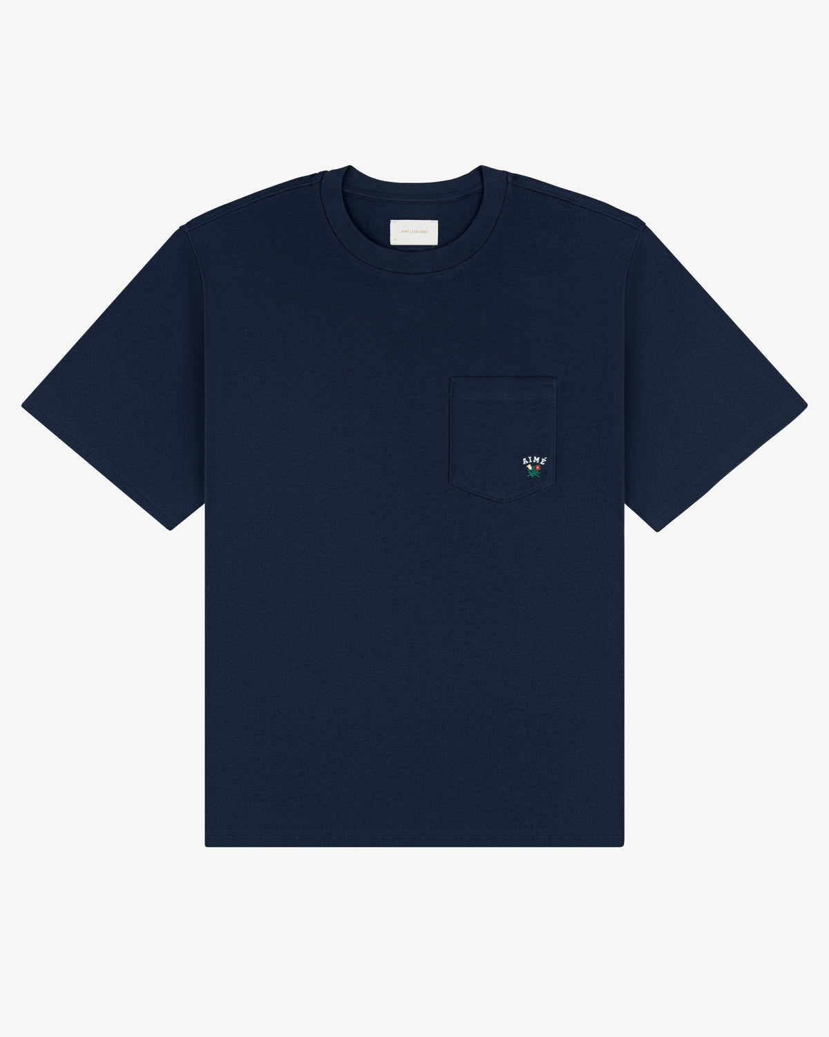 Navy Crest Pocket Tee with short sleeves, chest pocket, and small embroidered flower on the pocket.
